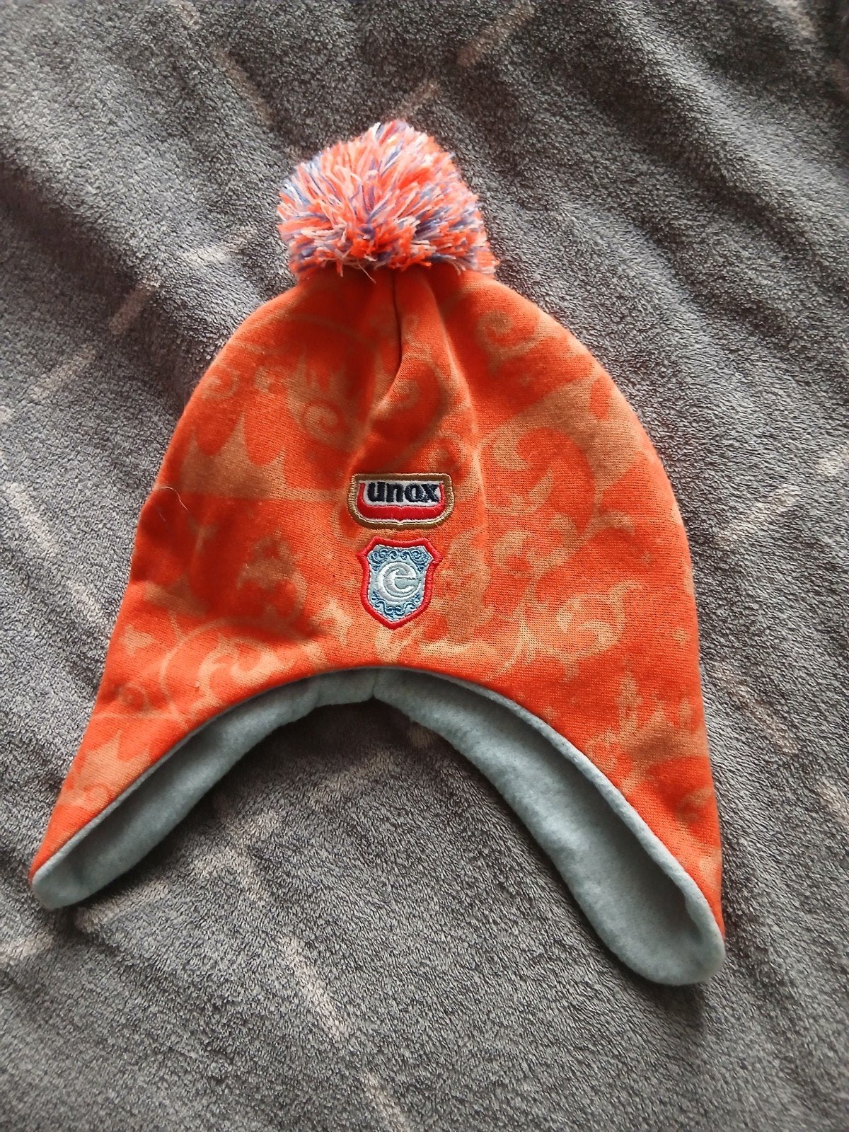 Unox muts voor kinderen - Oranje met pompon, Ophalen, Zo goed als nieuw