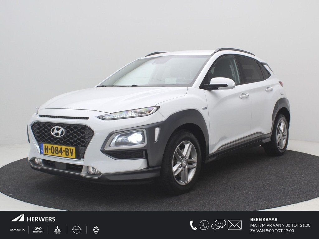 Hyundai Kona 1.6 GDI HEV Premium / Trekhaak / Lederen bekled, Auto's, Hyundai, Gebruikt, Euro 6, 2 kWh, Wit