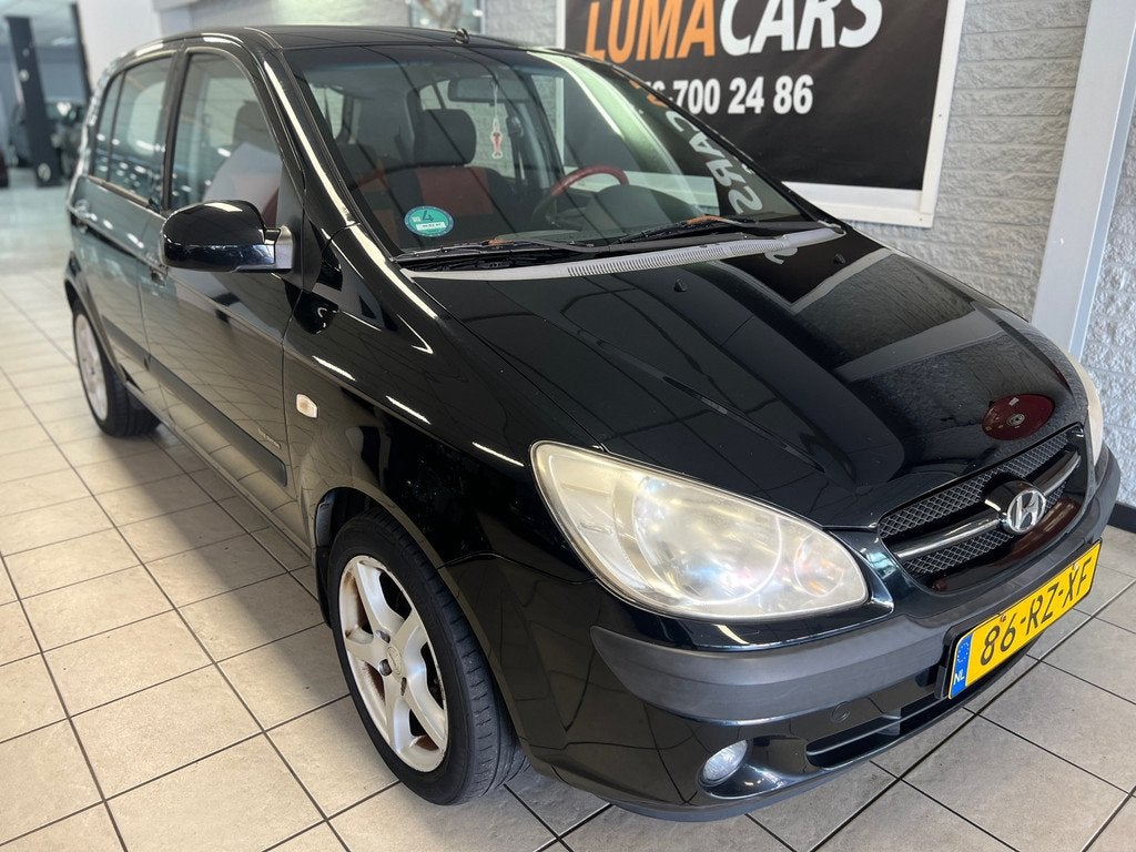 Hyundai Getz 1.4i First Edition | Airco | 5 deurs | Trekh. |, Auto's, Voorwielaandrijving, 450 kg, 4 cilinders, Zwart