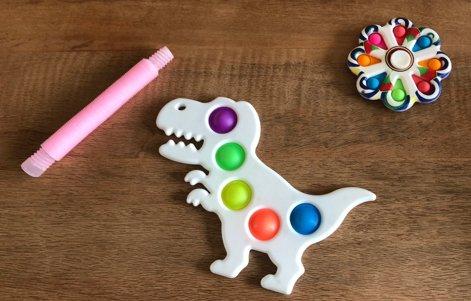3 fidgets pop it spinner, dino pop it en harmonica, Verzenden, Gebruikt