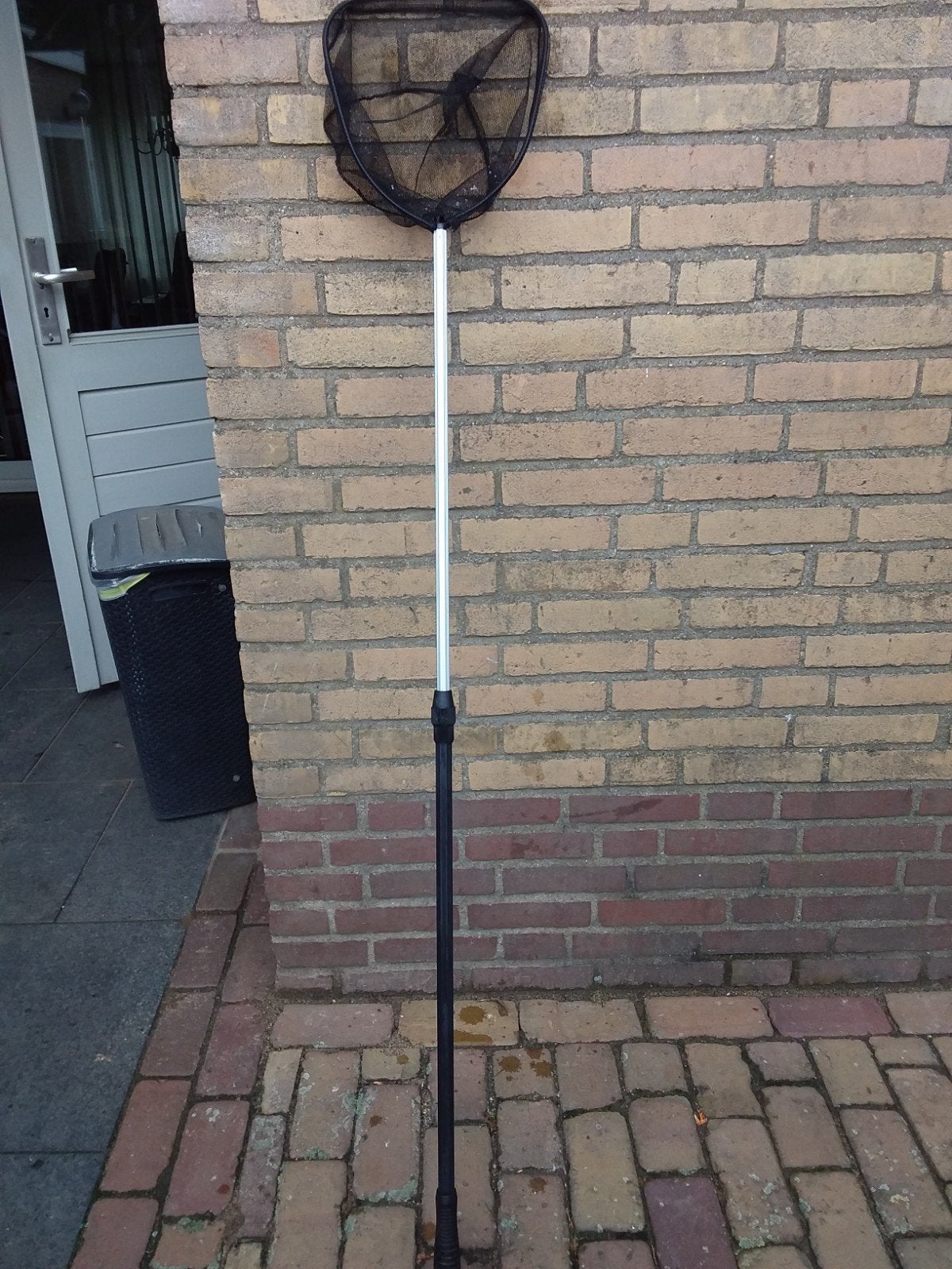 Schepnet en bus vijver visvoer., Ophalen