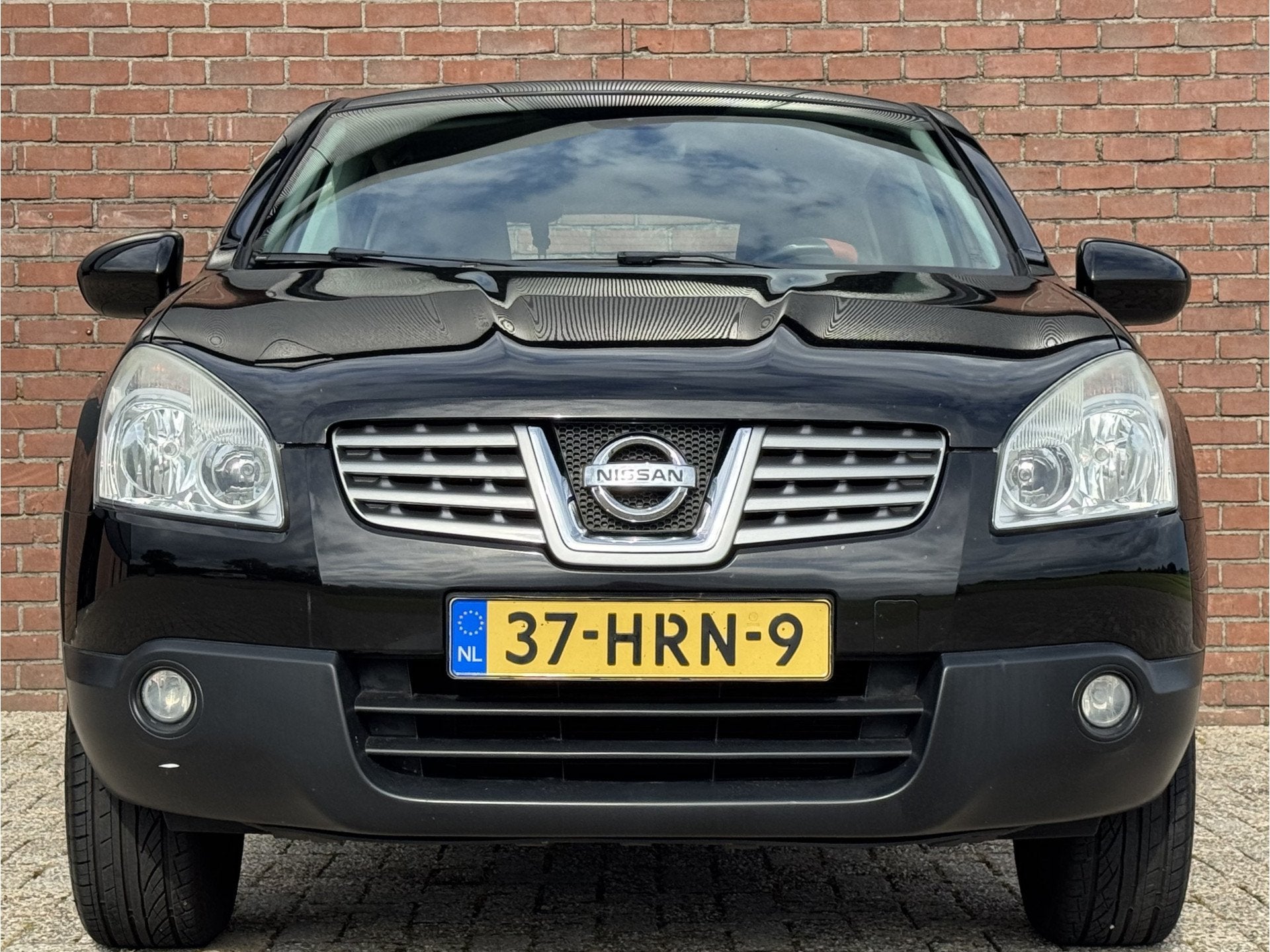 Nissan QASHQAI 1.6 ACENTA | NL-AUTO! | NAVI! | TREKHAAK!, Auto's, Voorwielaandrijving, 1272 kg, Gebruikt, Zwart