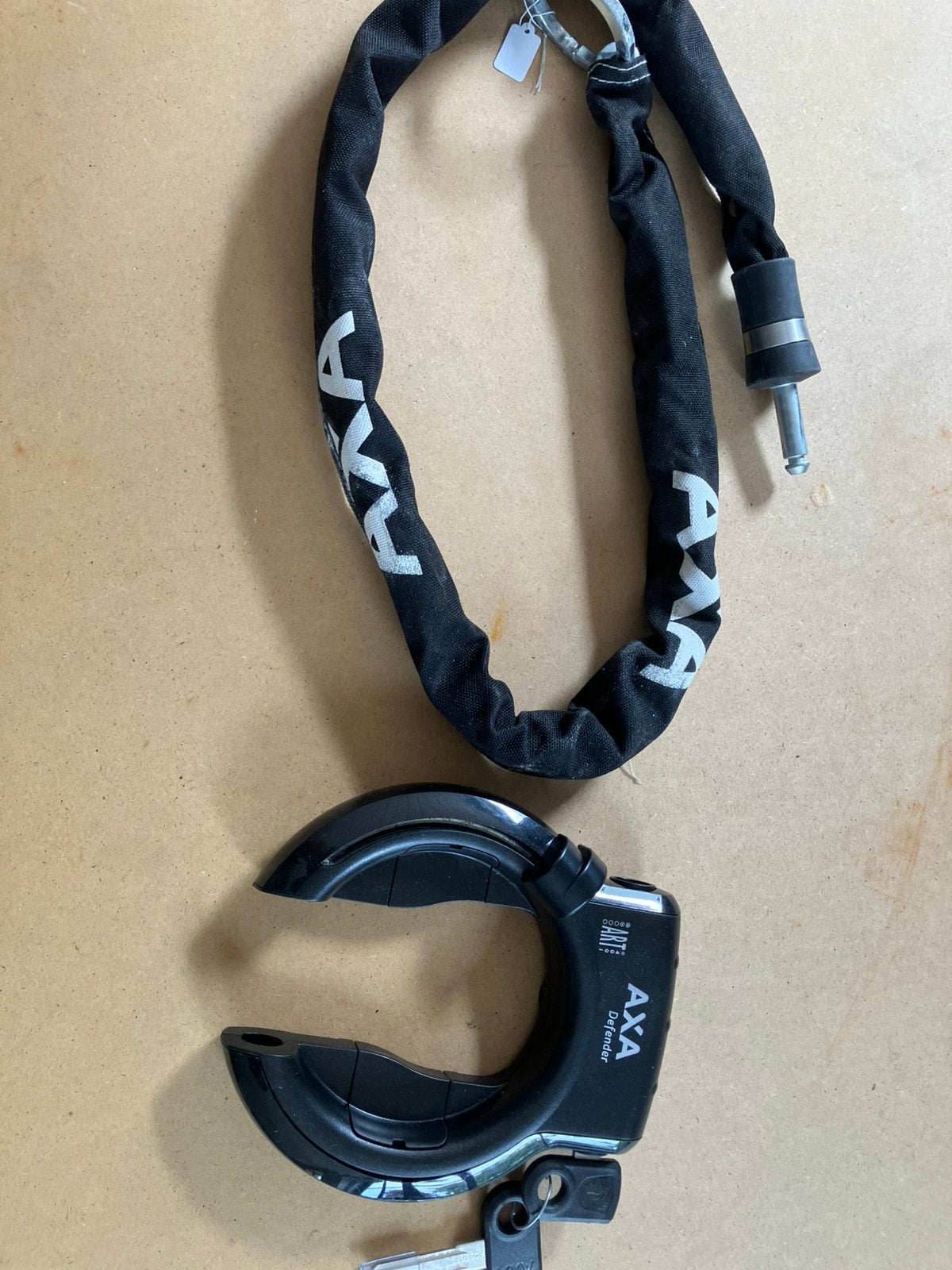 Nieuw combi axa defender met insteekketting, Ophalen of Verzenden, Zo goed als nieuw