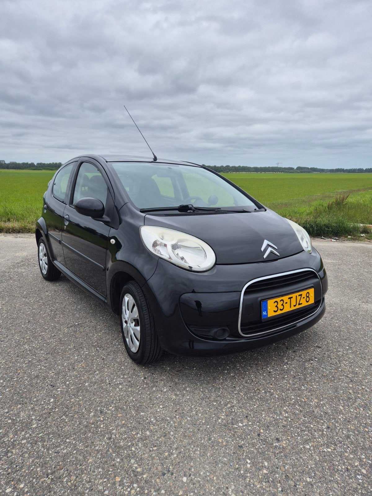 Citroën C1 1.0i 68PK 5D 2012 Zwart, Auto's, Citroën, Voorwielaandrijving, 4 stoelen, C1, Origineel Nederlands