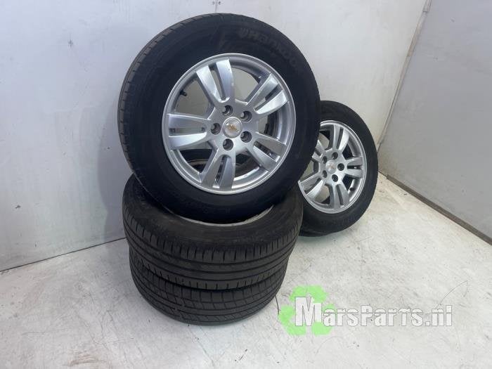 Velgen set + banden van een Chevrolet Aveo, Auto-onderdelen, Banden en Velgen, Gebruikt, -, -, Ophalen of Verzenden