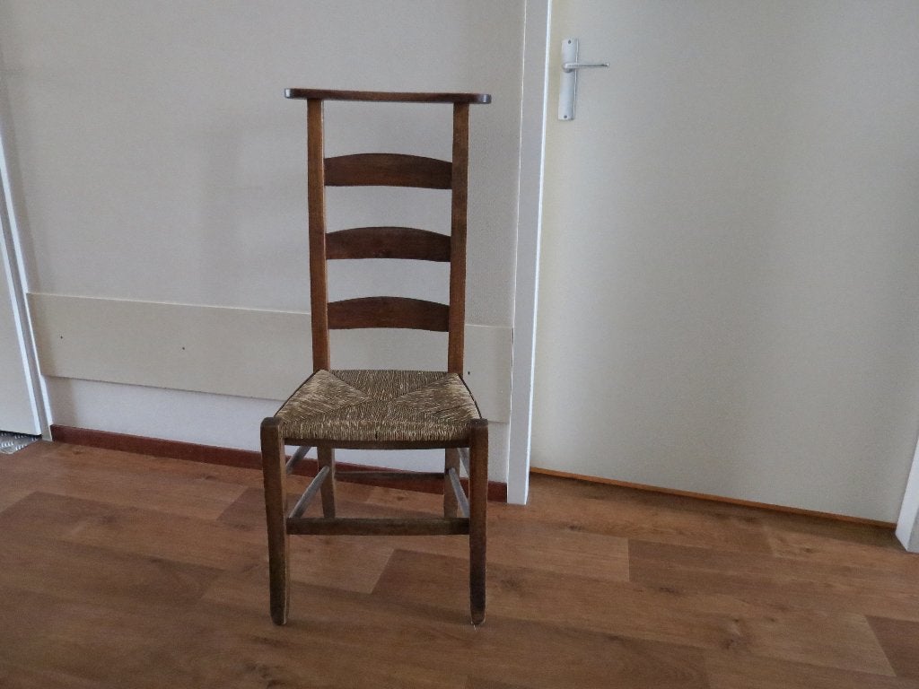 kerkstoel bruin met rieten zitting, Ophalen