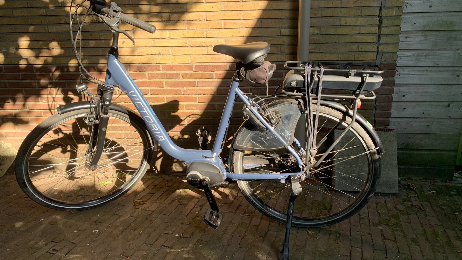 Te koop: elektrische herenfiets met lage instap, Zo goed als nieuw, 50 km per accu of meer, 55 tot 59 cm, Ophalen