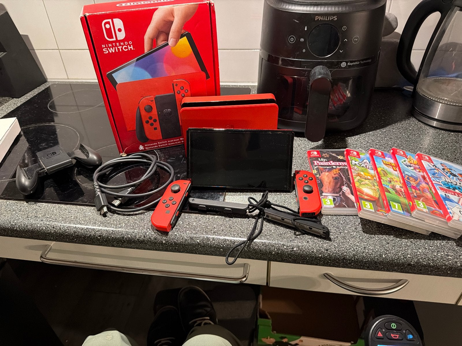 Nintendo Switch OLED Mario Red Edition met 5 games