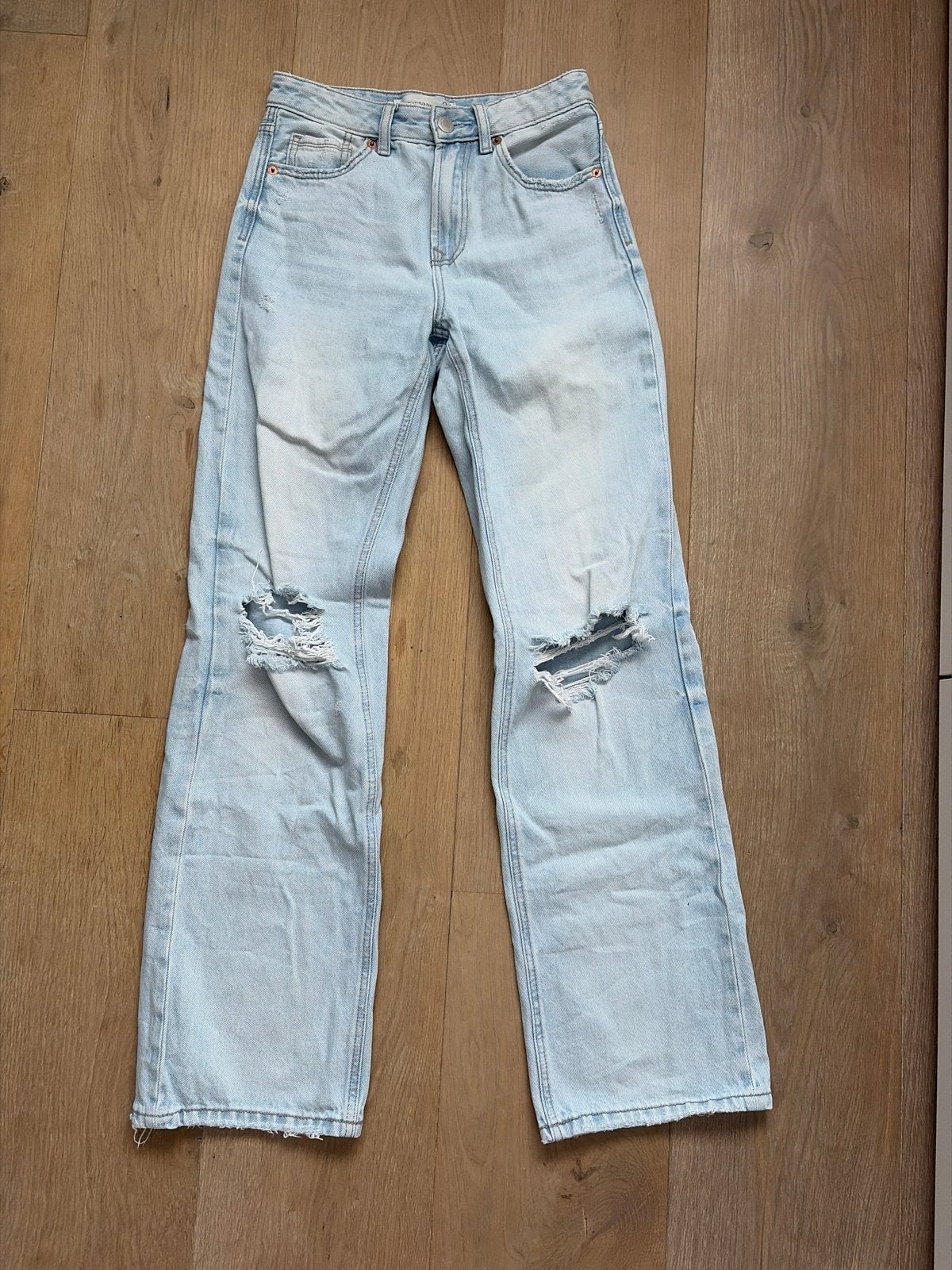 Stradivarius lichtblauwe wide leg jeans D92 maat 34, Ophalen of Verzenden, Zo goed als nieuw, Blauw, W27 (confectie 34) of kleiner