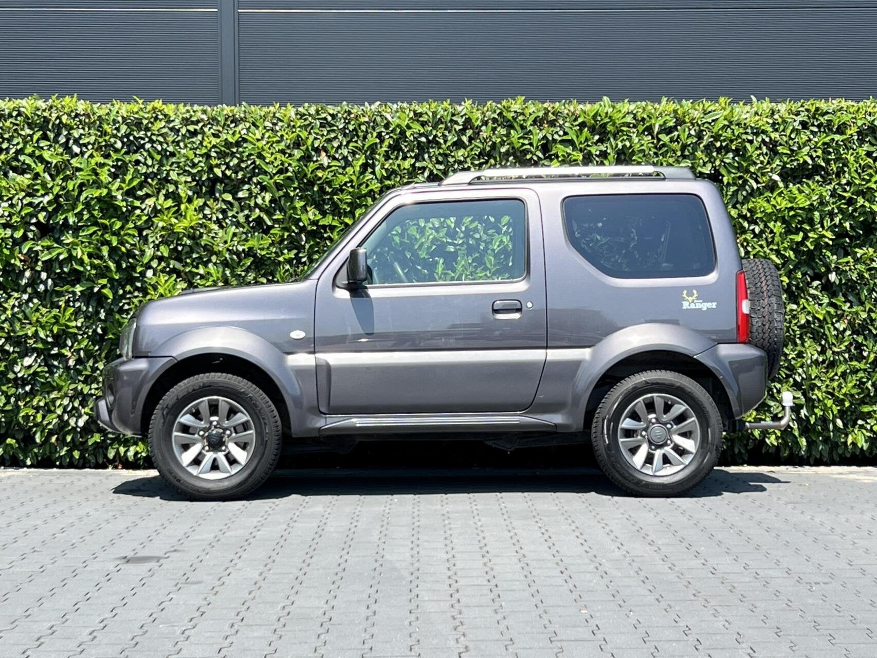 Suzuki Jimny 1.3 Exclusive RANGER, LEDER, AIRCO, STOELVERWAR, Auto's, Suzuki, 86 pk, Gebruikt, Zwart, 4 stoelen
