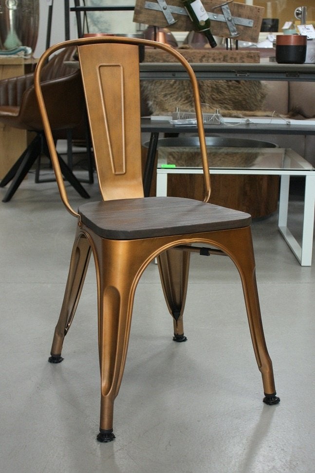 Partij eetkamerstoelen Tolix metaal koper hout horeca stapel