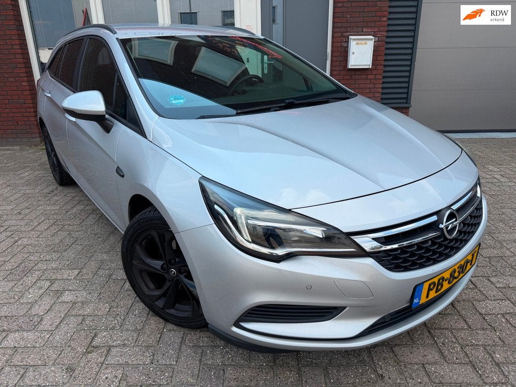 Opel Astra Sports Tourer 1.0 Online Edition / Navi / Camera, Stof, Gebruikt, 1178 kg, Met garantie (alle)