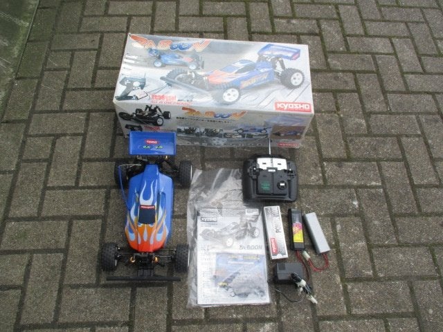 Kyosho buggy met doos en boekje, Elektro, Gebruikt, Auto offroad, Ophalen of Verzenden