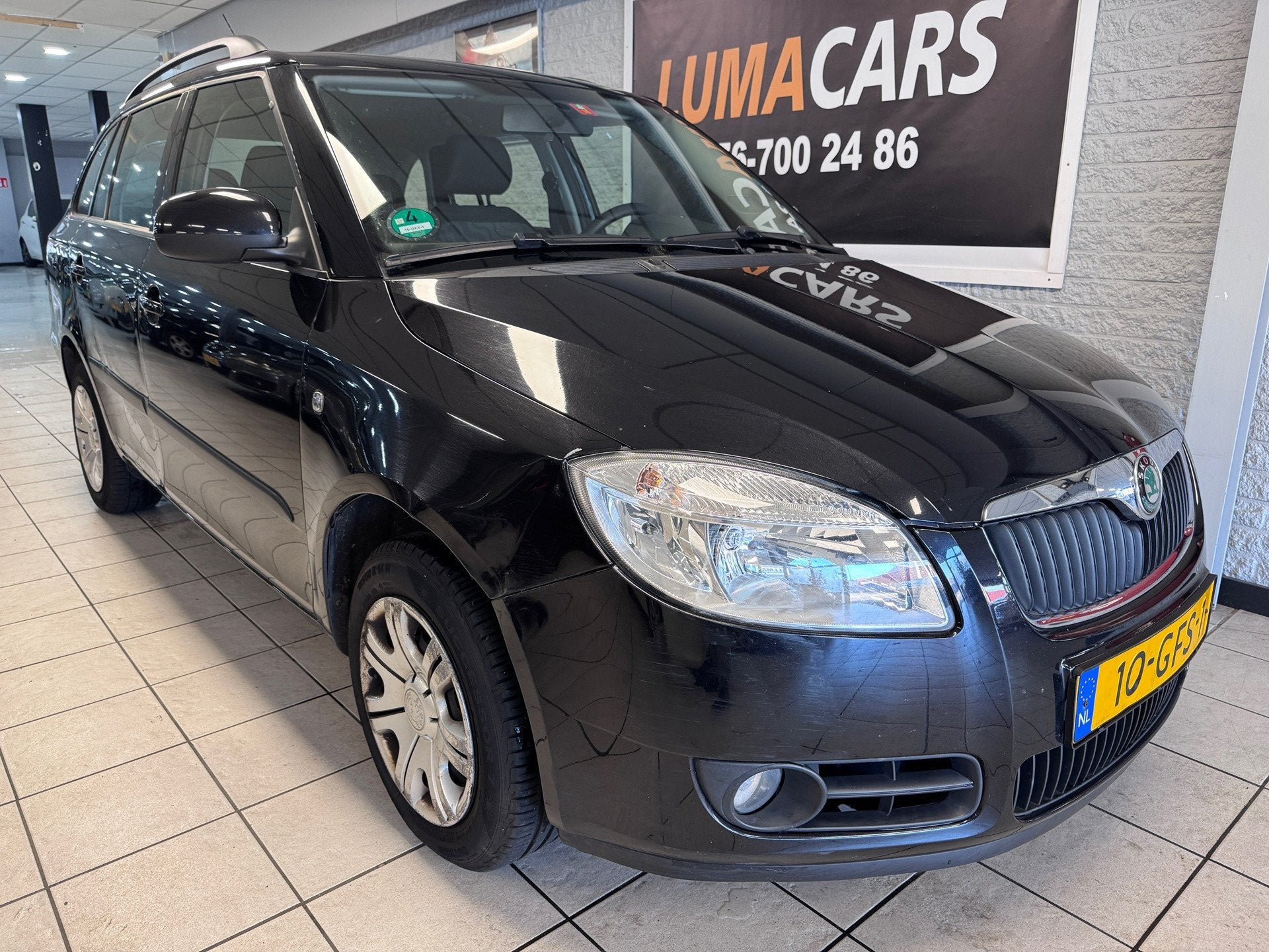 Skoda Fabia Combi 1.4-16V Ambiente | Nieuwe APK | Cruise |, Voorwielaandrijving, 4 cilinders, Verwarmde buitenspiegels, Zwart