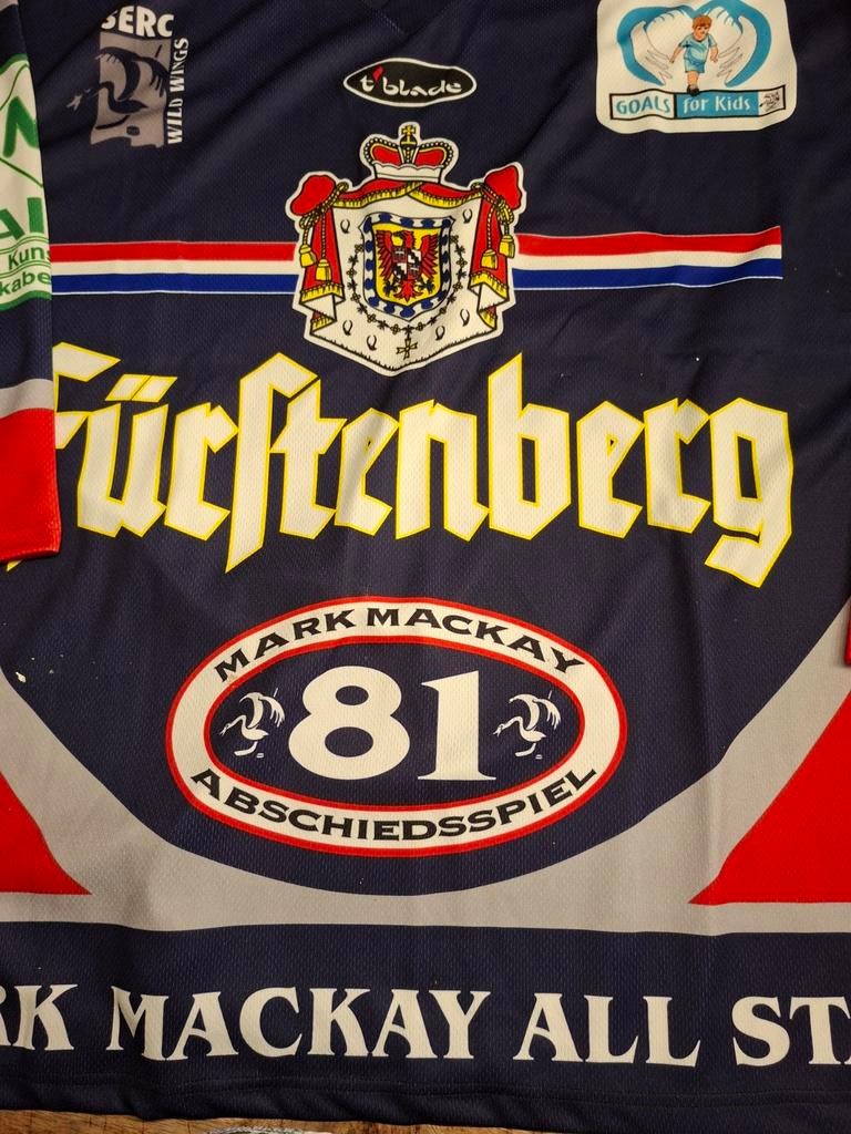 IJshockey shirt Schwenninger Wild Wings Mark Mackay, Sport en Fitness, IJshockey, Ophalen of Verzenden, Gebruikt, Kleding