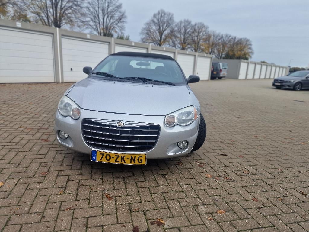 Chrysler Sebring Cabriolet 2004 Grijs, Auto's, Chrysler, 450 kg, Zwart, 4 stoelen, Leder en Stof