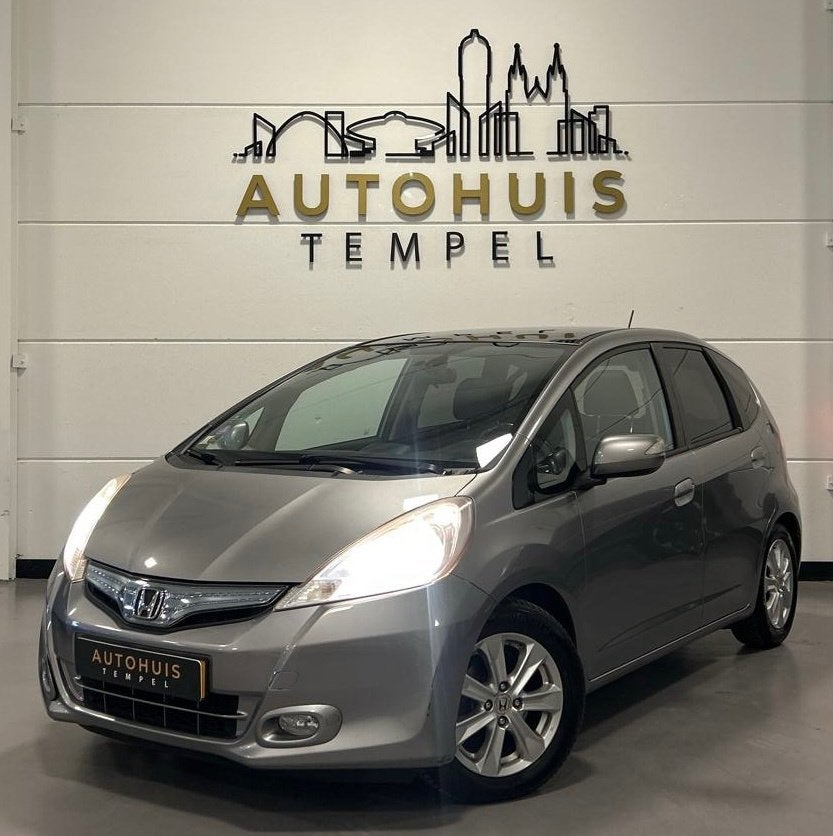 Honda Jazz 1.4 Hybrid Exclusive Automaat Nap 1E Eigenaar Dea, Auto's, Euro 5, Gebruikt, Zwart, 4 cilinders
