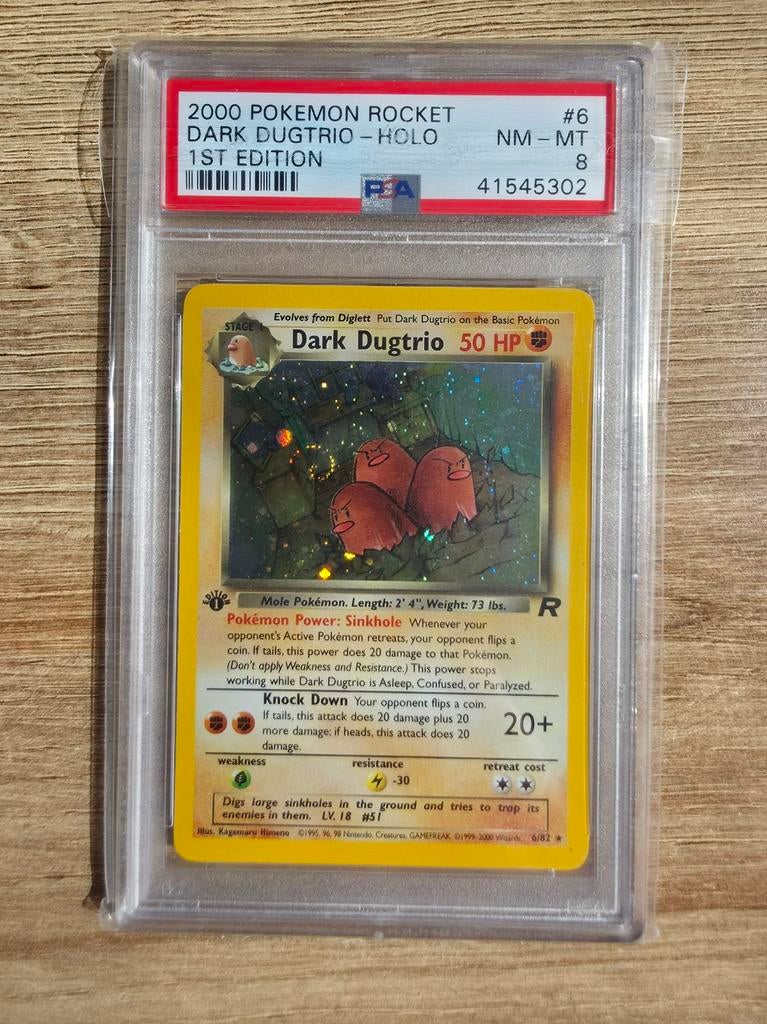 Pokémon Dark Dugtrio Holo 1st Edition PSA 8 Swirl #6, Ophalen of Verzenden, Zo goed als nieuw, Losse kaart, Foil