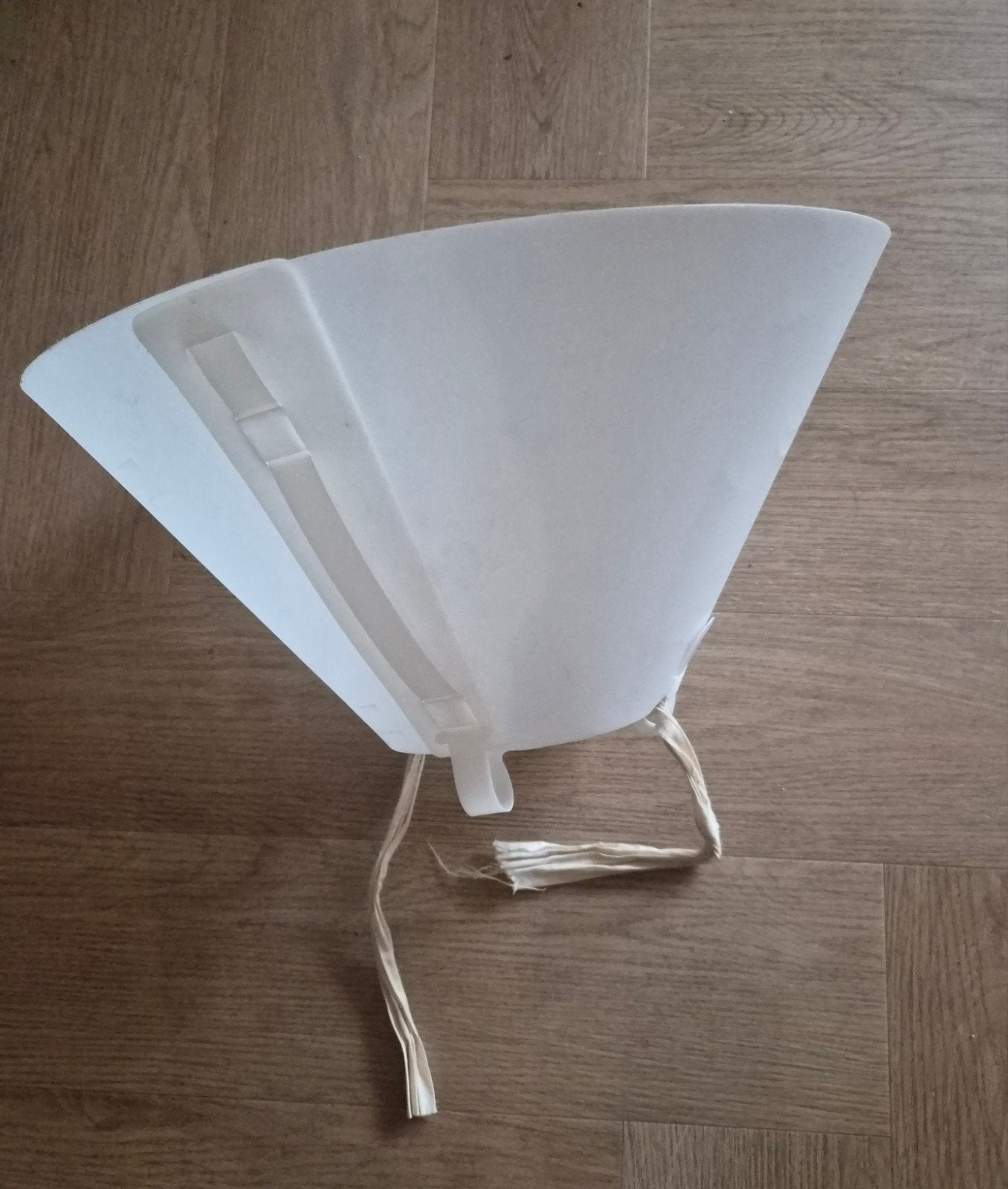 Hondenkap/hondenkraag voor na een operatie o.i.d., Ophalen