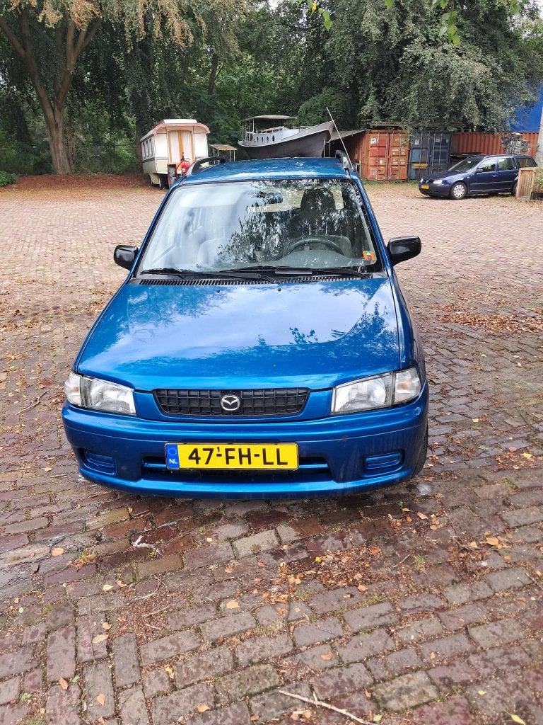 Mazda Demio 1.3 Comfort 2000 Blauw APK 6-4-2027, Blauw, Grijs, Particulier, Onderhoudsboekje