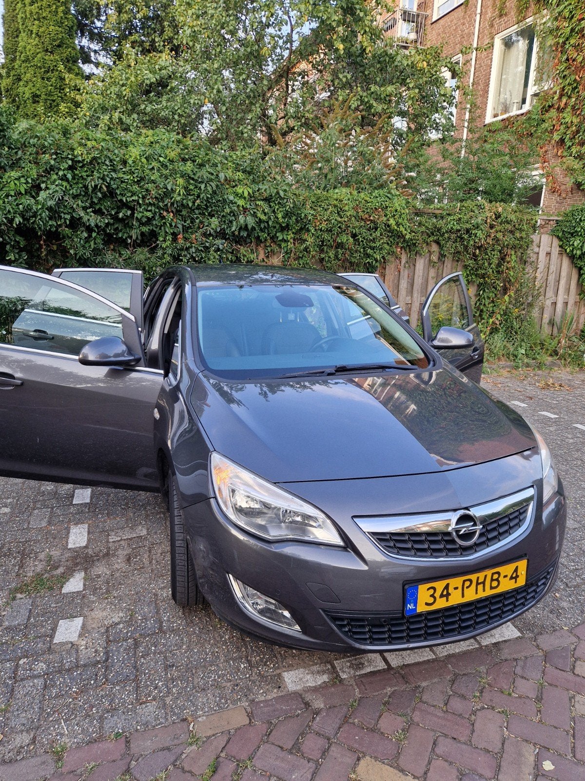 Opel Astra 1.4 Turbo Ecotec 103KW 5-D 2011 Grijs, Auto's, Voorwielaandrijving, Euro 5, 4 cilinders, Leder en Stof