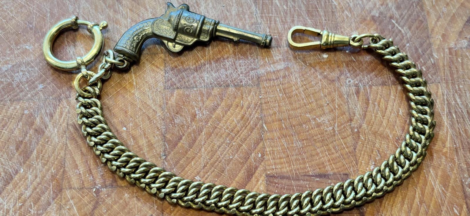 Mooi oud horloge ketting met revolver hanger, Ophalen of Verzenden, Overige materialen, Ketting