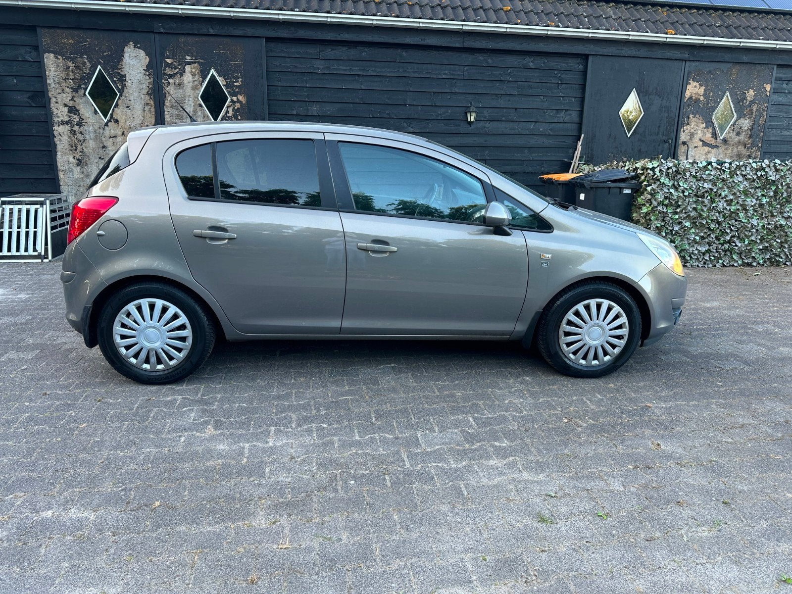 Opel Corsa 1.2 Twinport 85pk 5d 2010 Bruin, Voorwielaandrijving, 4 cilinders, Bruin, 1229 cc