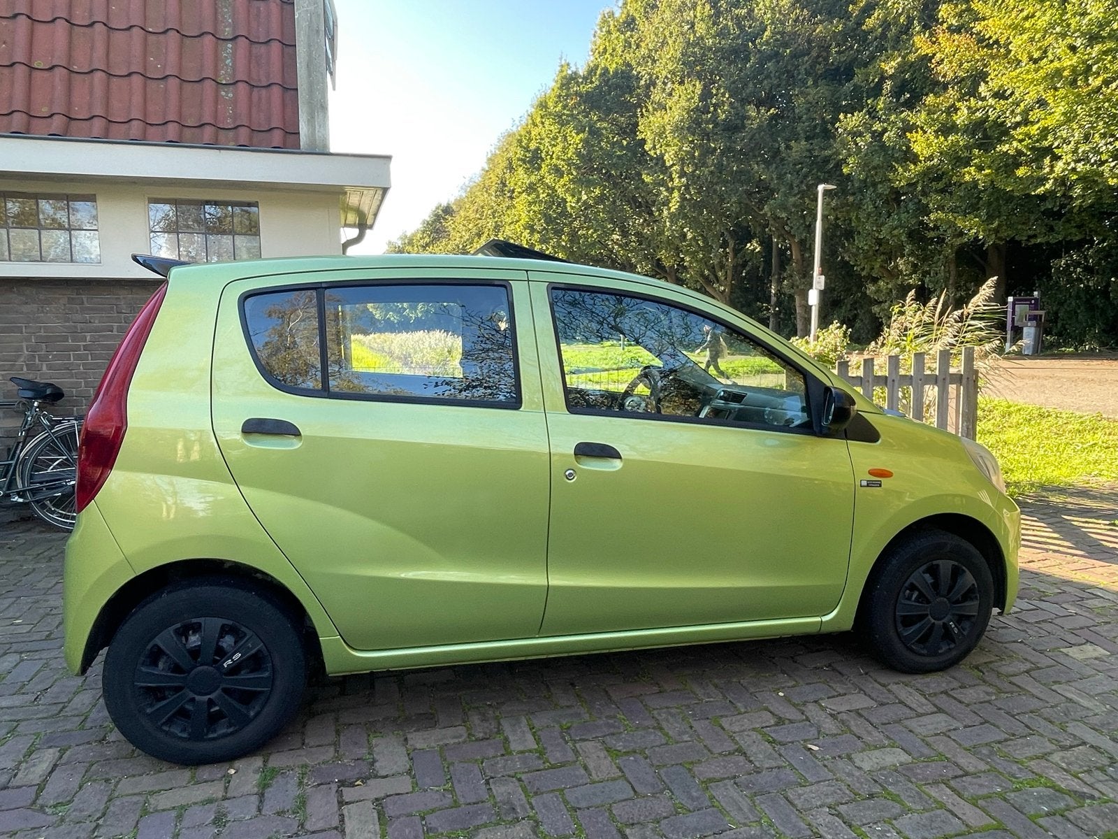 Daihatsu Cuore 1.0 5D 2009 Groen, Auto's, Voorwielaandrijving, Stof, 600 kg, Zwart