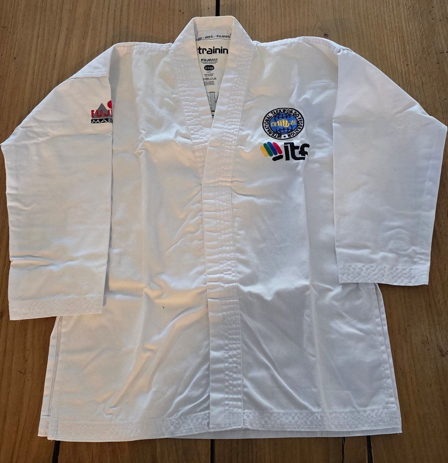 Taekwondo pak Fujimae maat 2/150 met witte band, Ophalen of Verzenden, Zo goed als nieuw, Vechtsportpak