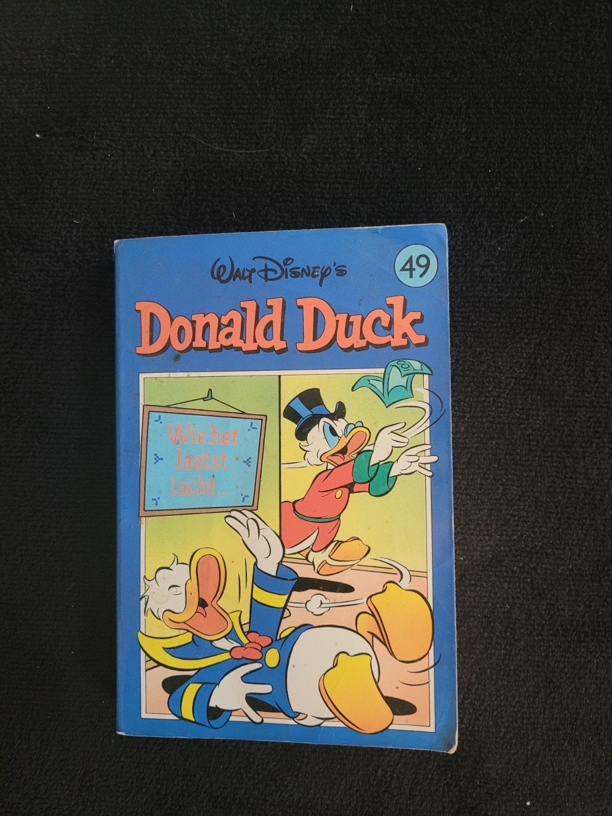 Donald Duck 49 - Wie het laatst lacht..., Boeken, Eén stripboek, Ophalen of Verzenden, Gelezen, Walt Disney