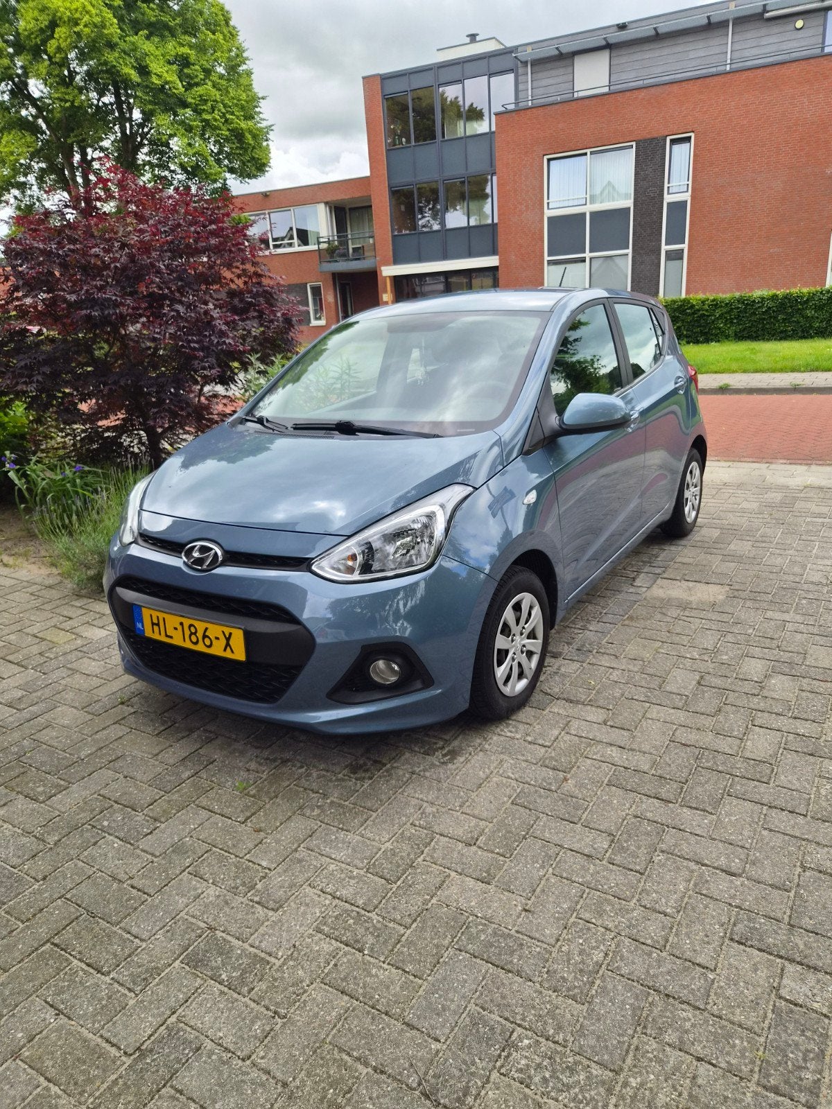 Hyundai i10 1.0i 66pk 2016 Blauw, Auto's, Stof, 31 €/maand, 23 km/l, Origineel Nederlands