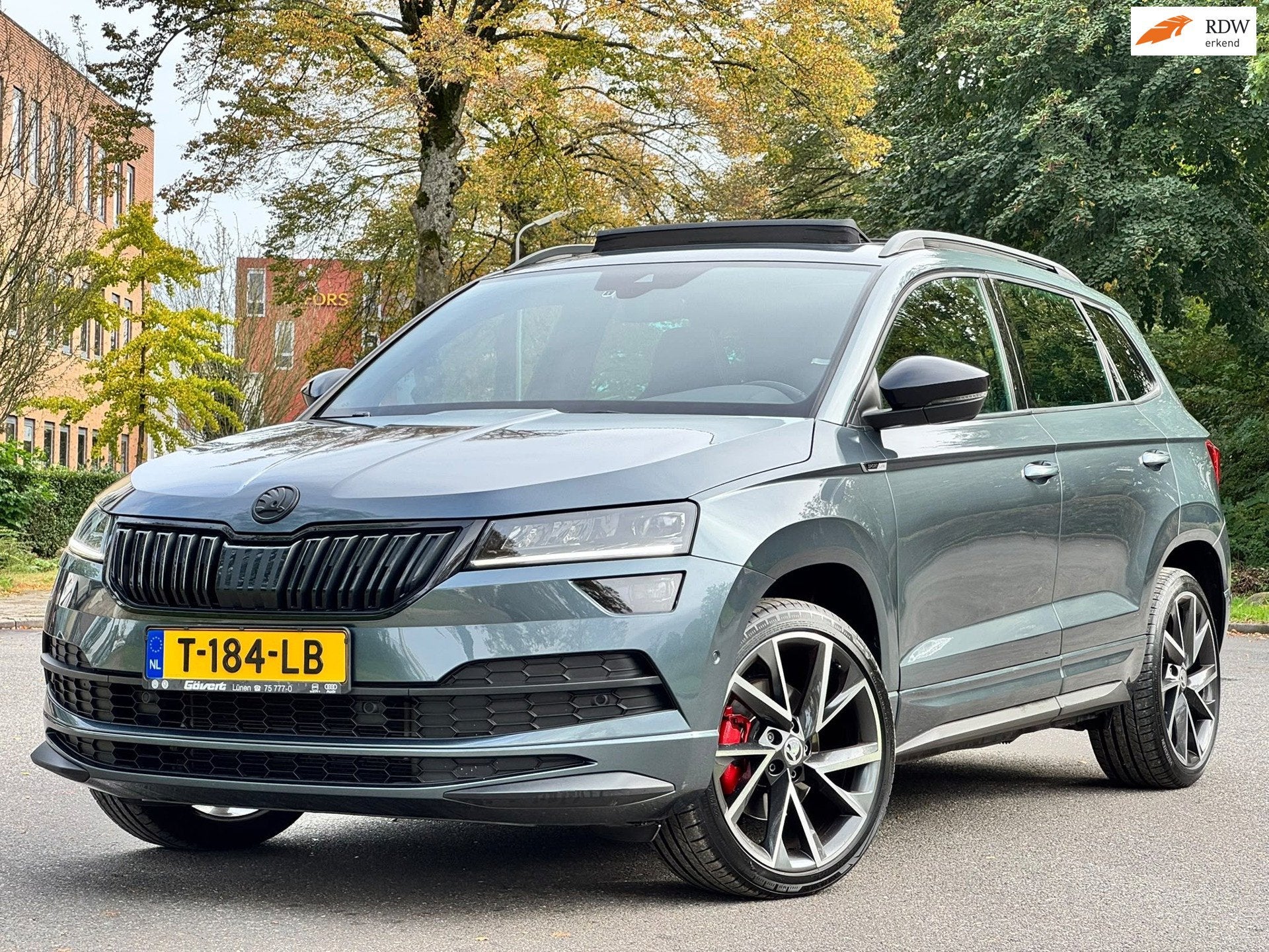 Skoda Karoq 2.0 TSI 4x4 Sportline Business, Auto's, Automaat, Gebruikt, Euro 6, 1984 cc