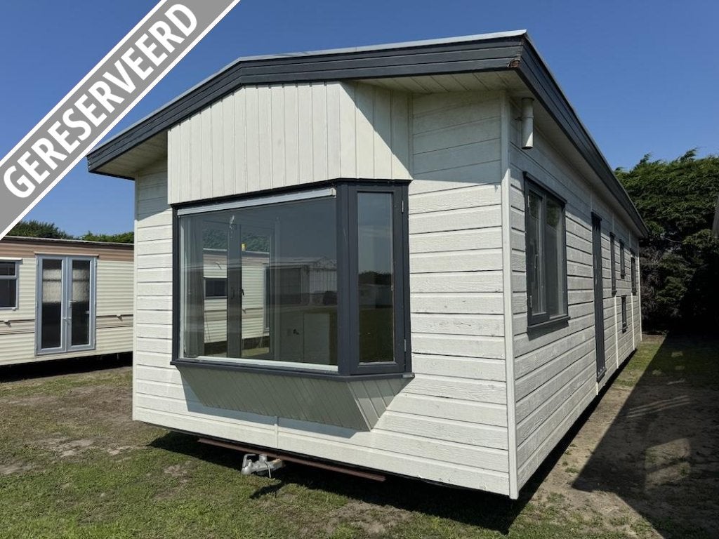 Spiegelbeeld winterhard chalet met 3 slaapkamers en CV, Caravans en Kamperen