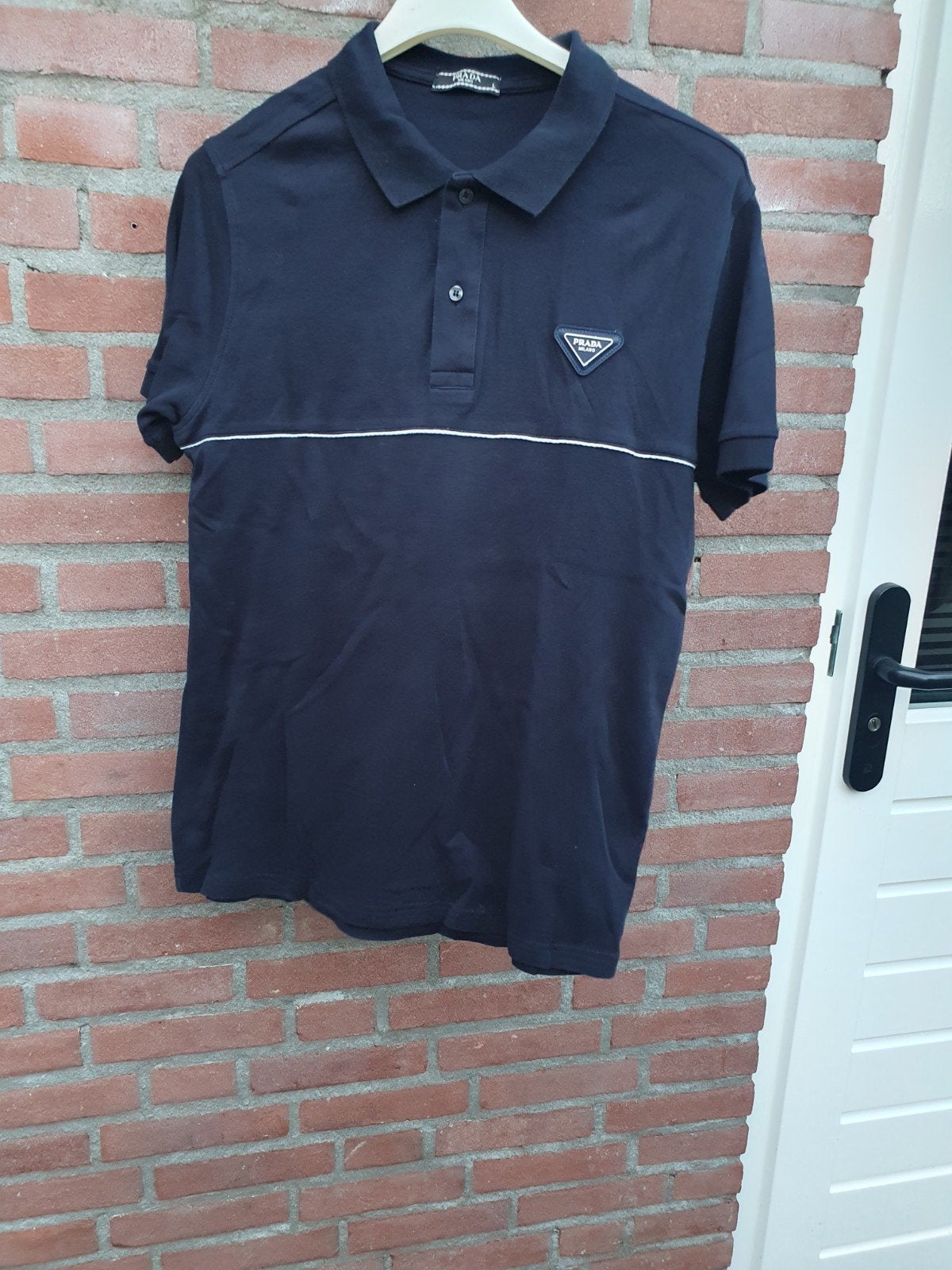 Te koop Prada polo maat L zwart, Ophalen of Verzenden, Zo goed als nieuw, Zwart