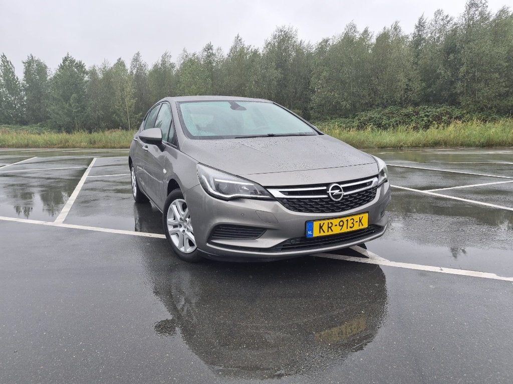 Opel Astra 1.0 Turbo 77KW 5D 2016 Bruin, Auto's, Opel, Stof, Euro 6, Bruin, 610 kg
