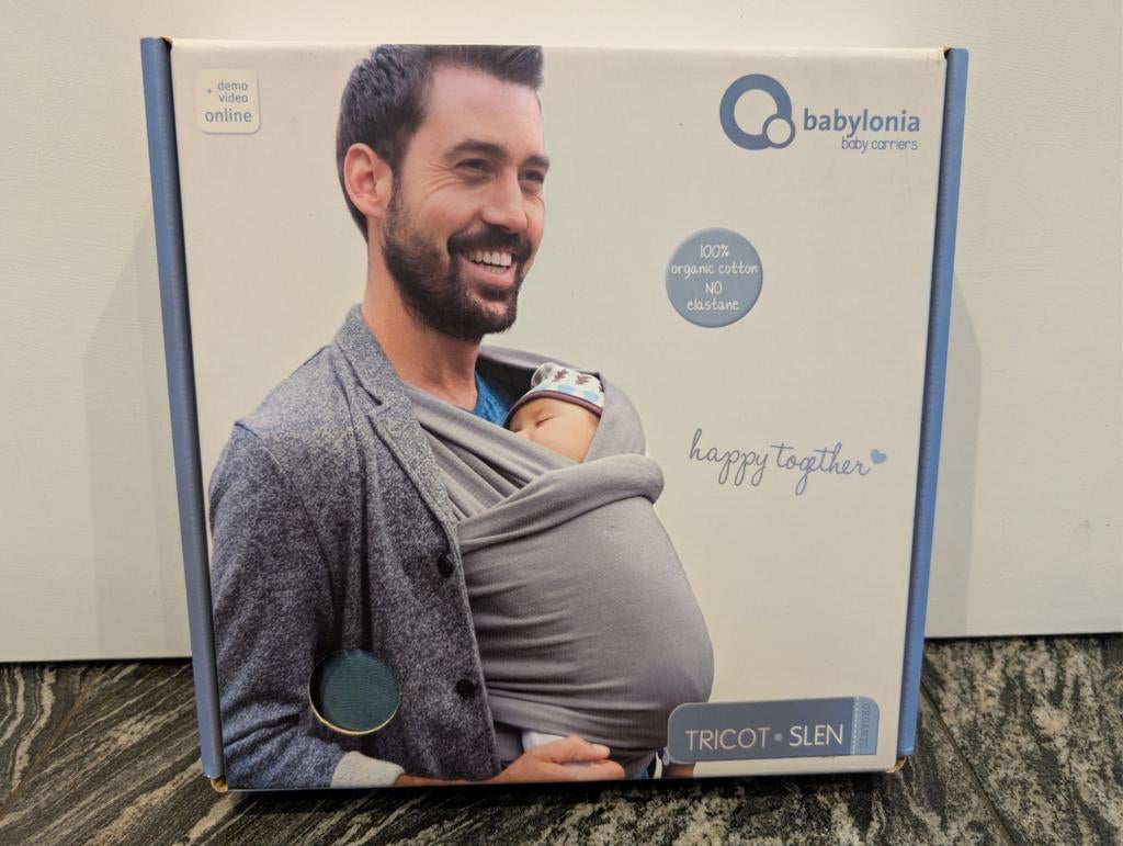 Babylonia tricot slen draagdoek. Nieuw., Kinderen en Baby's, Babydragers en Draagdoeken, Draagdoek, Nieuw, Buik, Ophalen