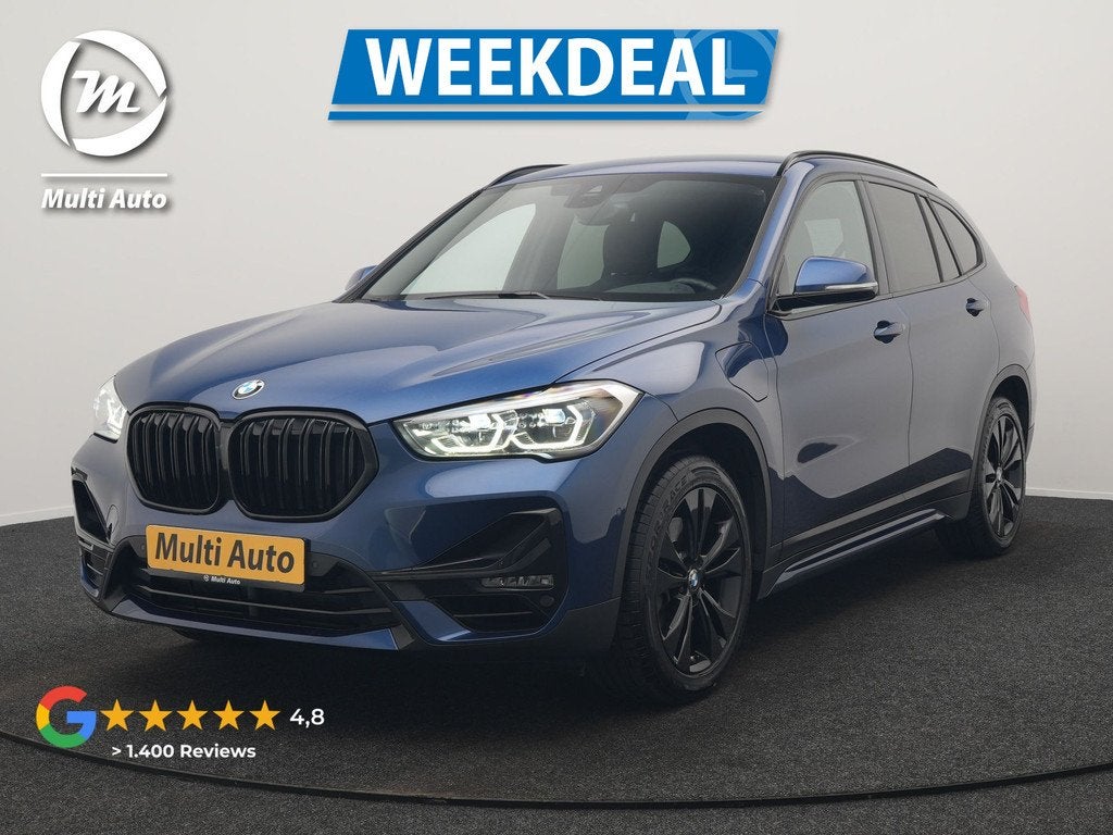 BMW X1 xDrive25e Sportline PHEV 221pk Dealer O.H. | Trekhaak, Auto's, BMW, Gebruikt, Blauw, Leder en Stof, Bedrijf