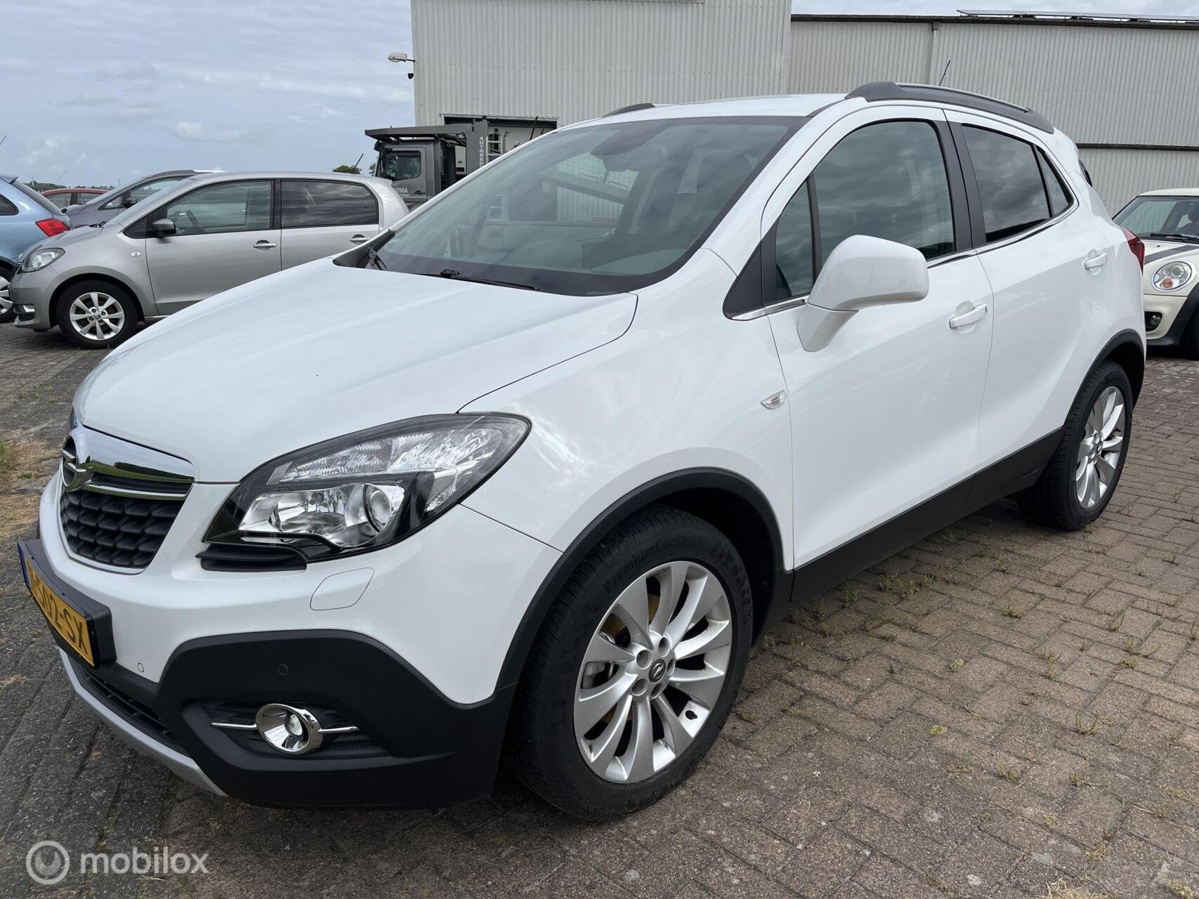 Opel Mokka 1.4 T Cosmo 4x4, Auto's, Gebruikt, Zwart, 4 cilinders, Leder en Stof