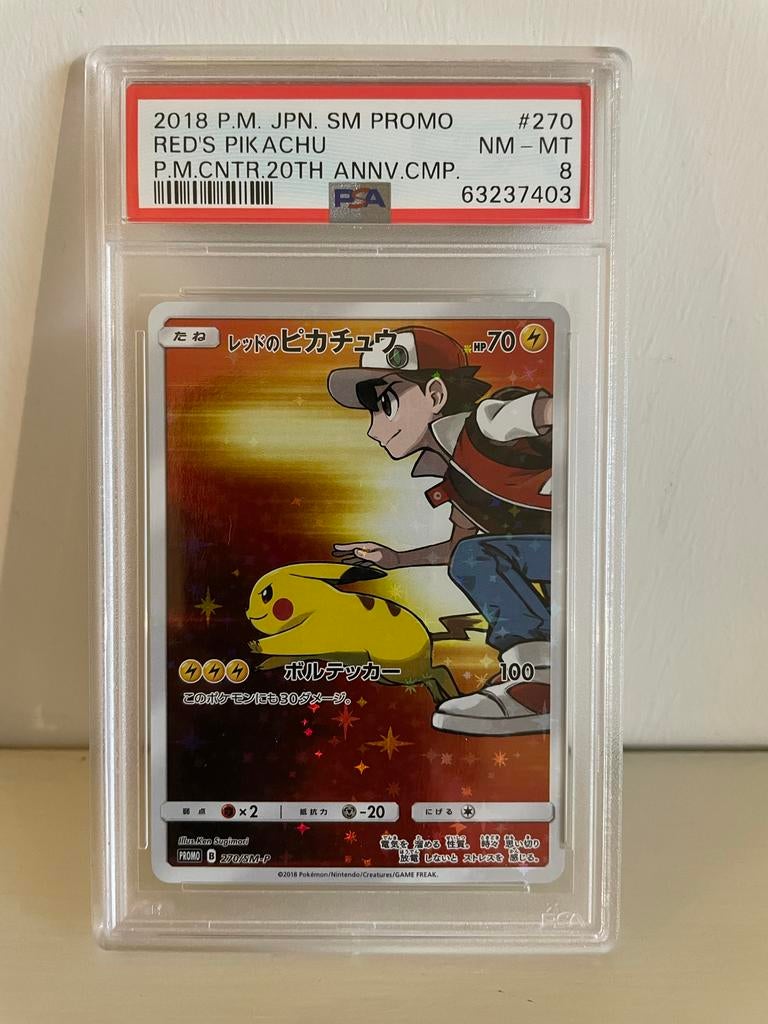 Red's Pikachu SM-P 270 PSA 8, Ophalen of Verzenden, Zo goed als nieuw, Losse kaart
