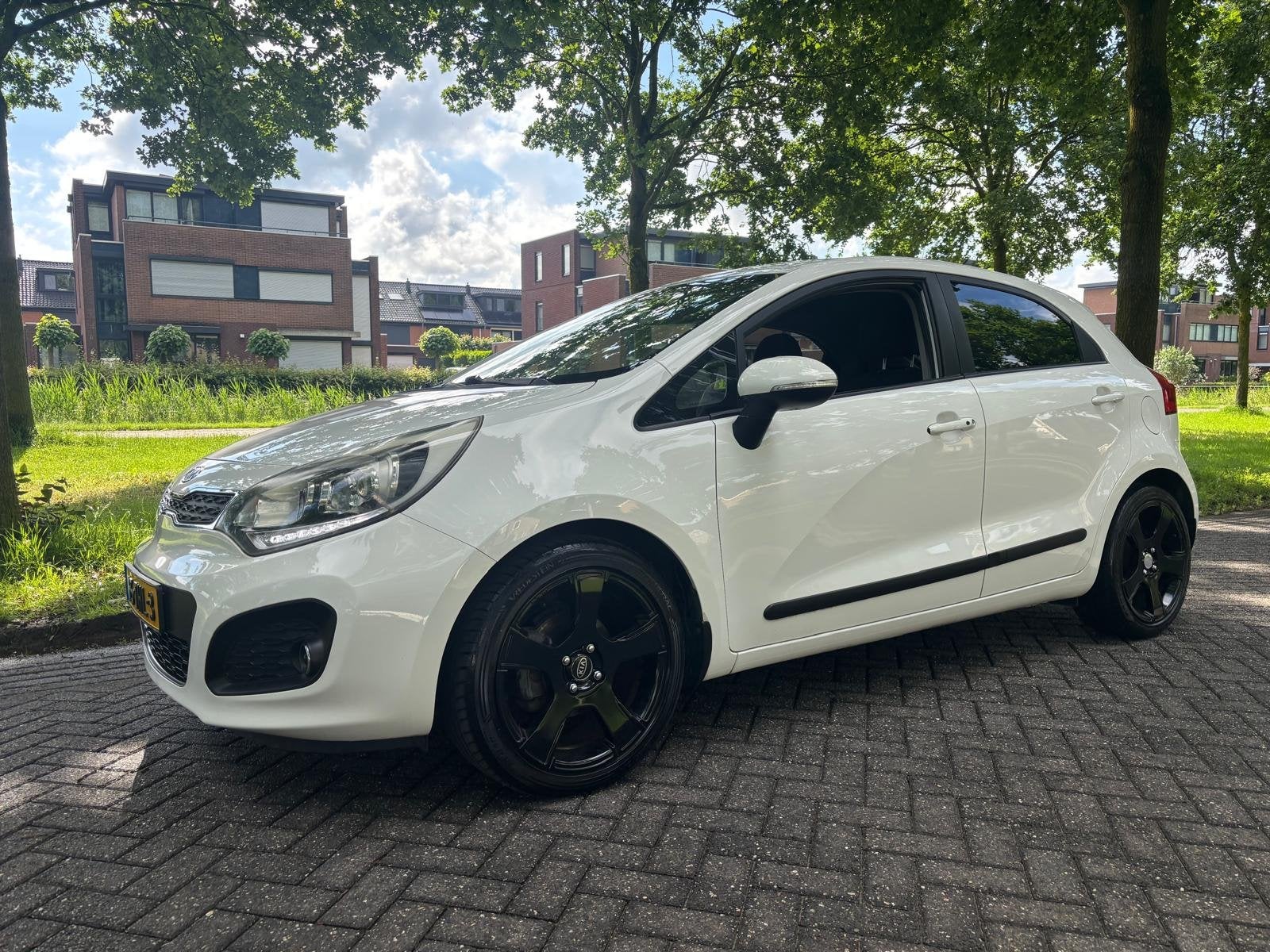 Kia Rio 1.2 CVVT Super Pack (bj 2012), Auto's, Euro 5, 4 cilinders, Wit, Origineel Nederlands