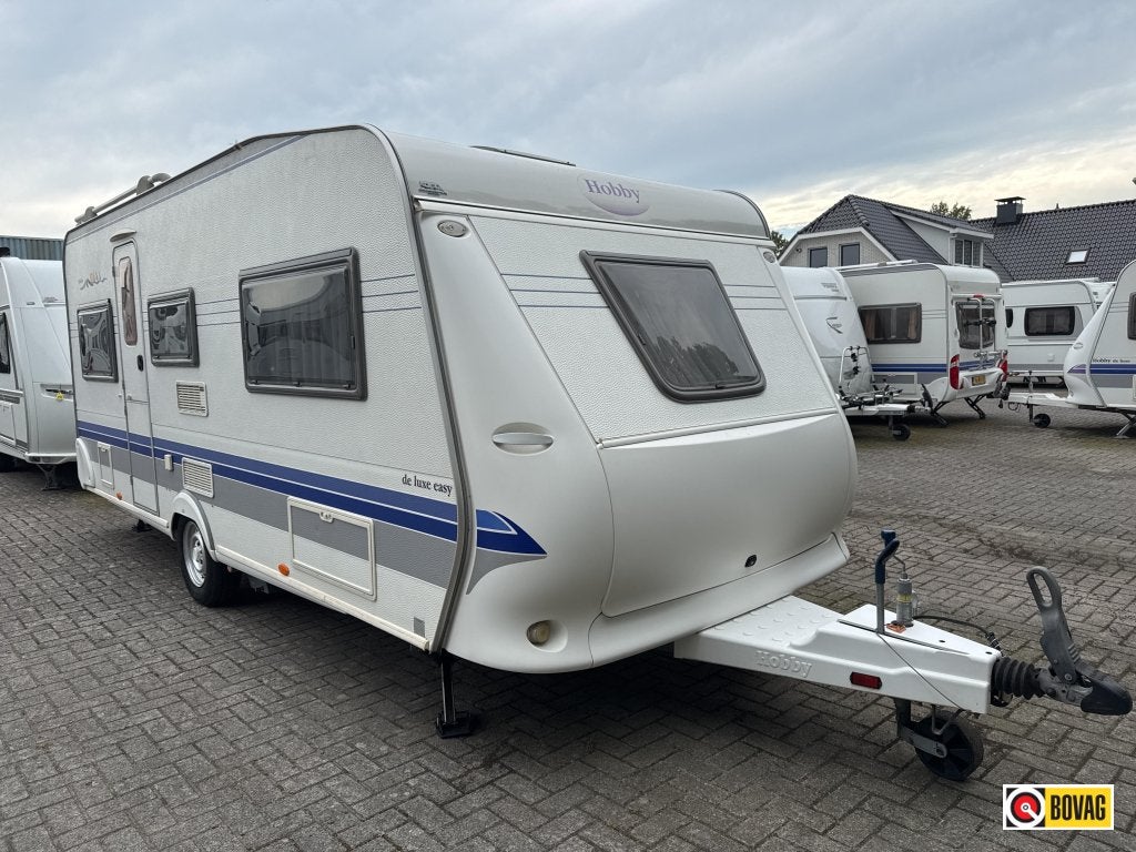 Hobby De luxe Easy 495 UL Mover/fietsdrager, Caravans en Kamperen, Rondzit, Bedrijf, Overige typen, Tot en met 4