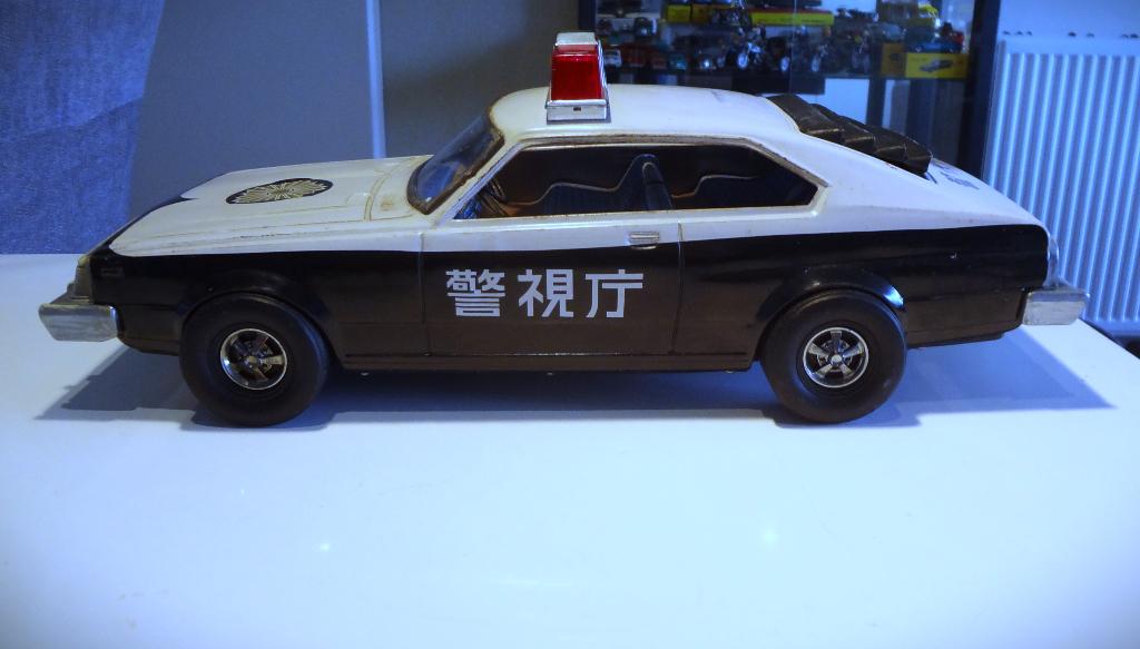 Blikken Nissan Skyline C210 uit 1979 Ichiko Frictie motor, Antiek en Kunst, Antiek | Speelgoed, Verzenden