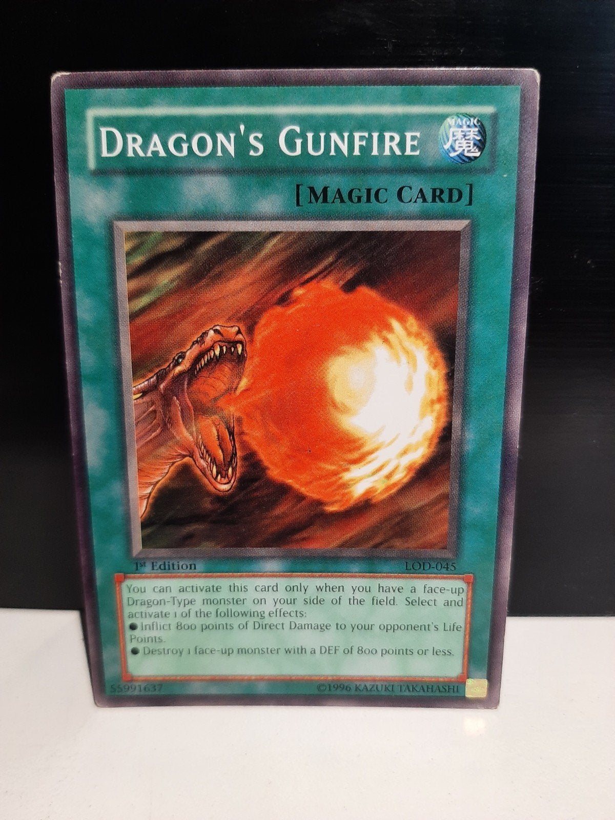 Yu-Gi-Oh! Dragon's Gunfire - 1st Edition LOD-045, Ophalen of Verzenden, Zo goed als nieuw, Losse kaart