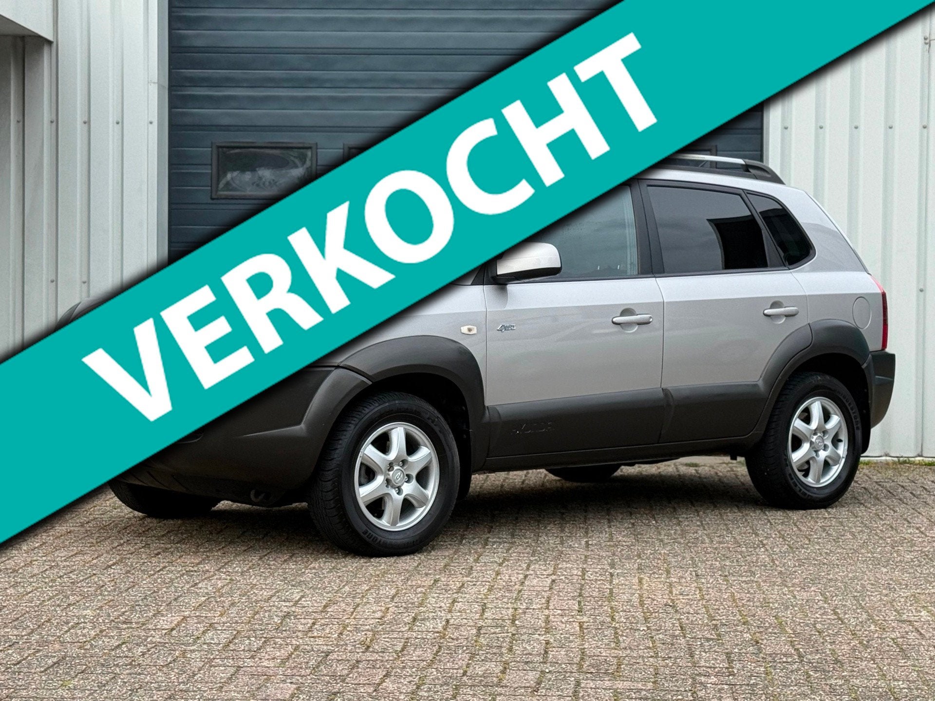 Hyundai Tucson 2.7i V6 4WD Style 2e EIG / AUTOMAAT / LEER, Auto's, Automaat, Stoelverwarming, Gebruikt, 2656 cc