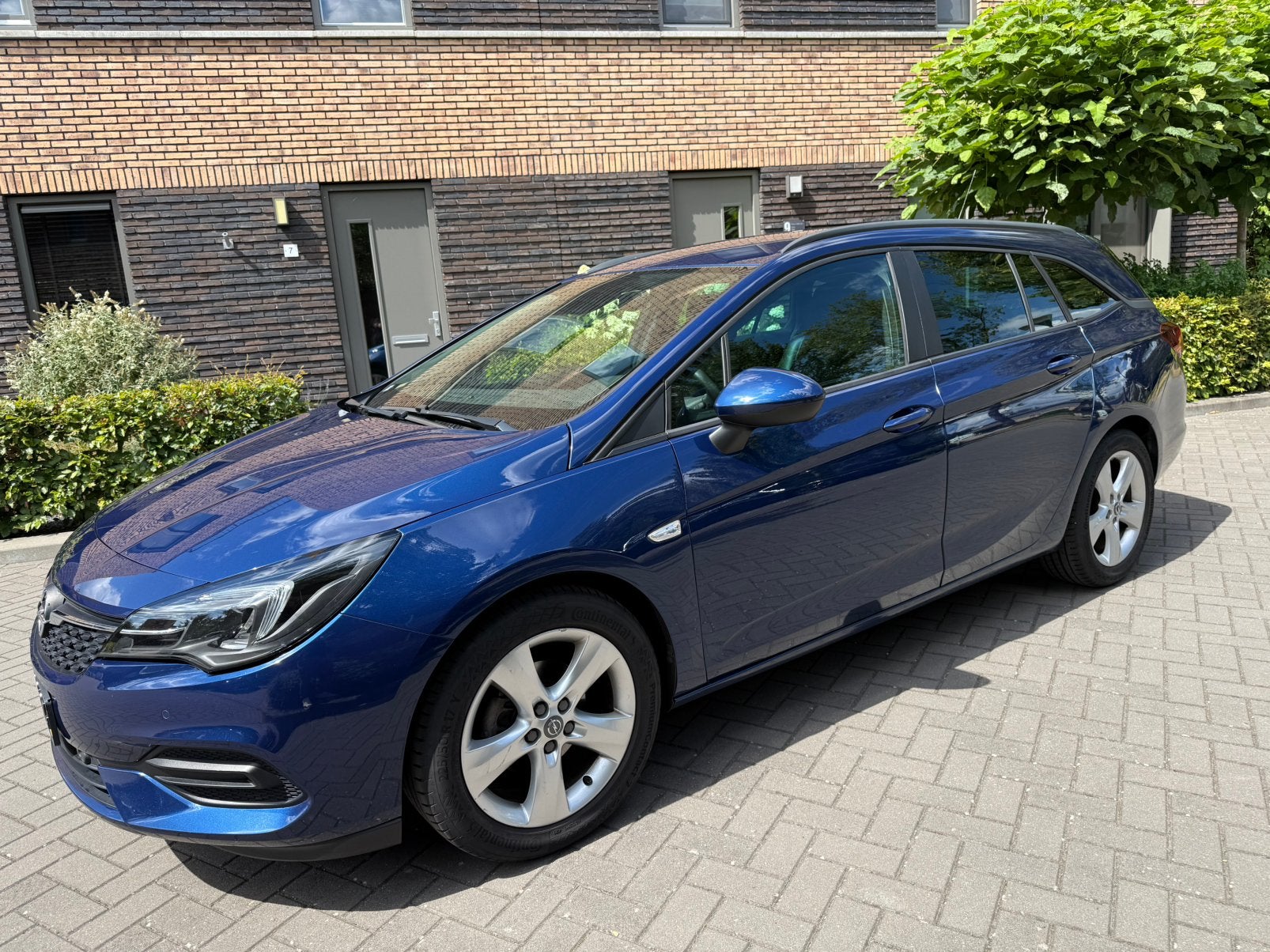 Opel Astra 1.2 Turbo 130pk Start/stop 2021 Blauw, Auto's, 1250 kg, 1199 cc, Blauw, Stationwagon