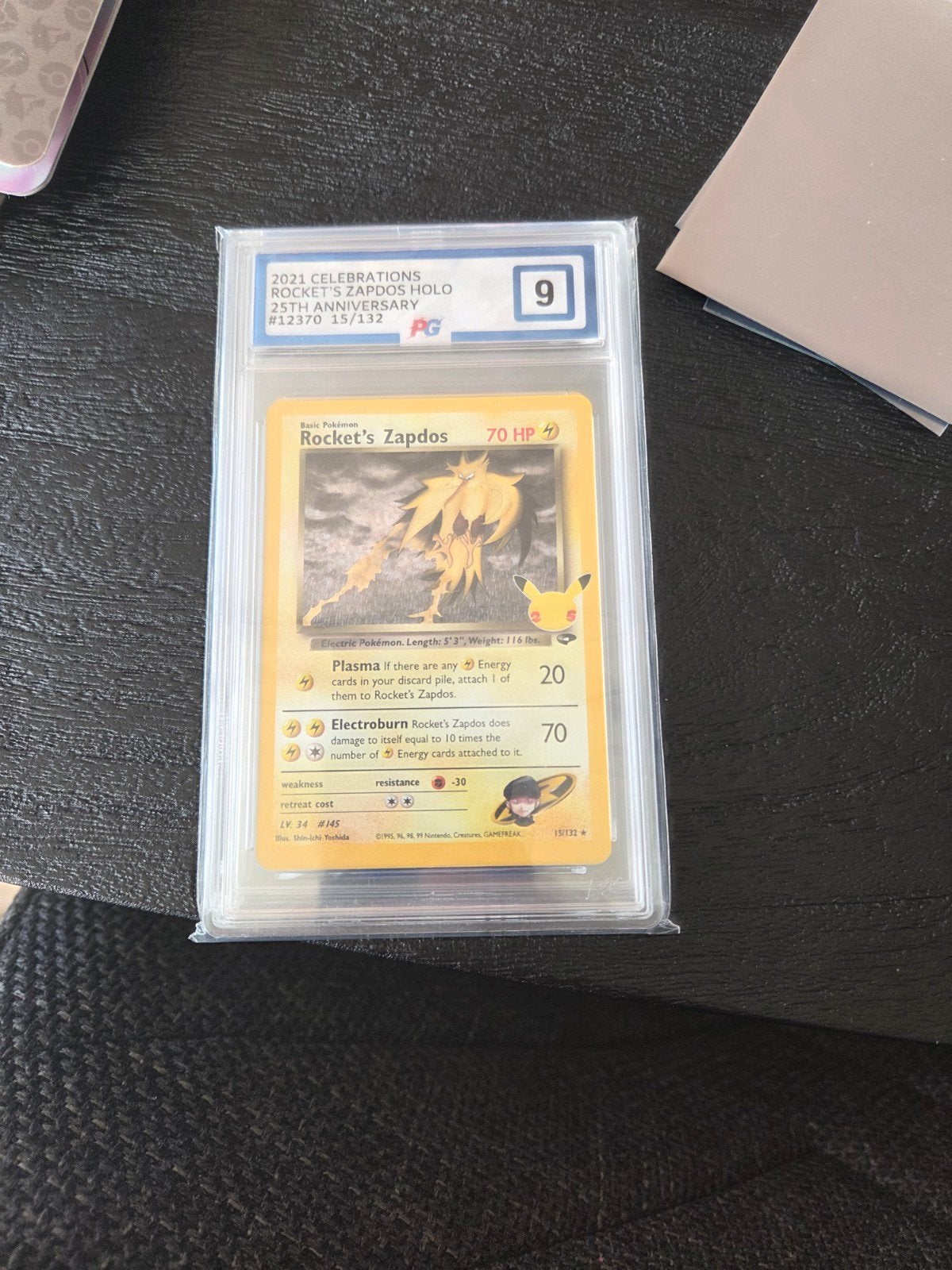Pokémon Rocket's Zapdos Holo 25th Anniversary PG 9, Ophalen of Verzenden, Zo goed als nieuw, Losse kaart