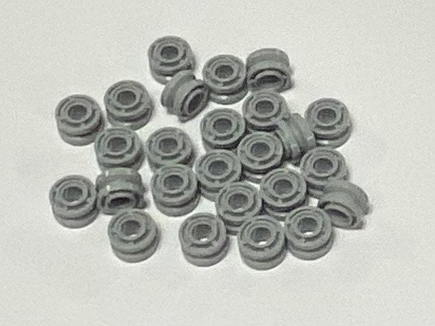 Partij 25x nieuwe Lego lichtgrijze wielen D. x 8mm