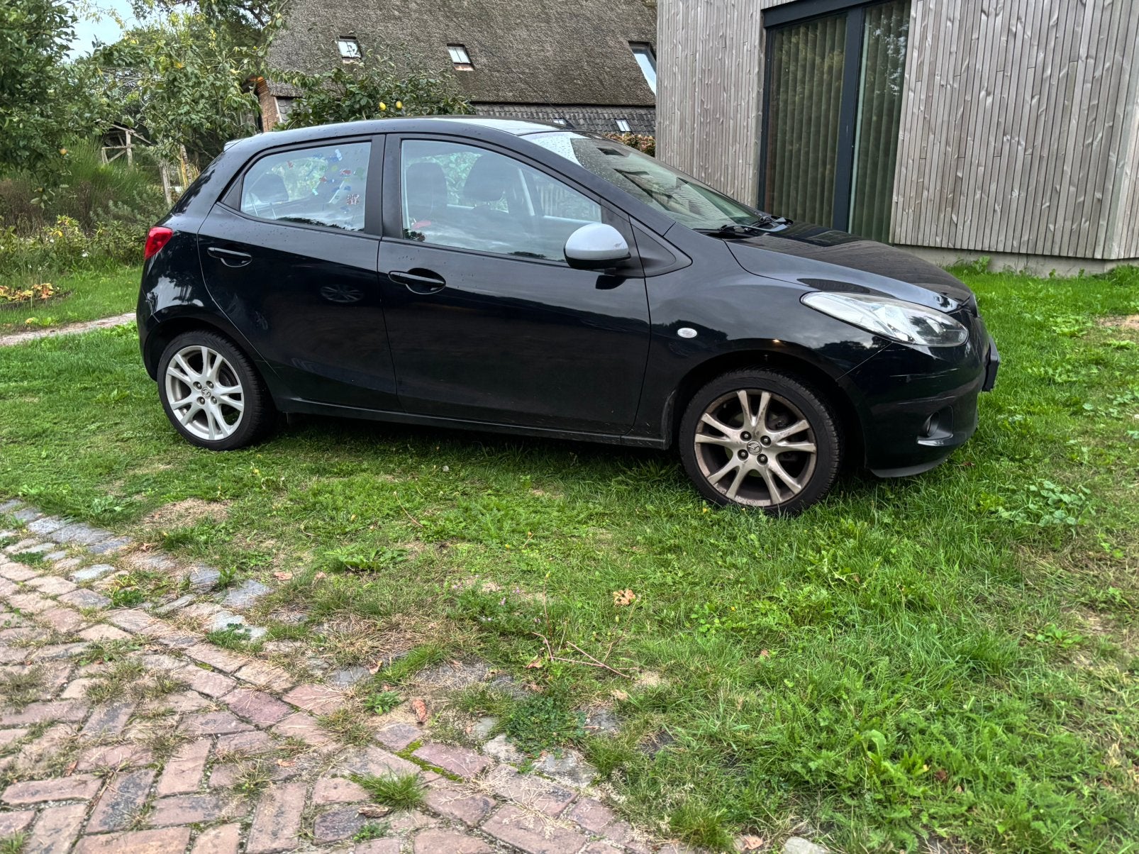 Mazda 2 1.4 63KW 5DRS 2009 Zwart, Auto's, Stof, 4 cilinders, Zwart, Origineel Nederlands