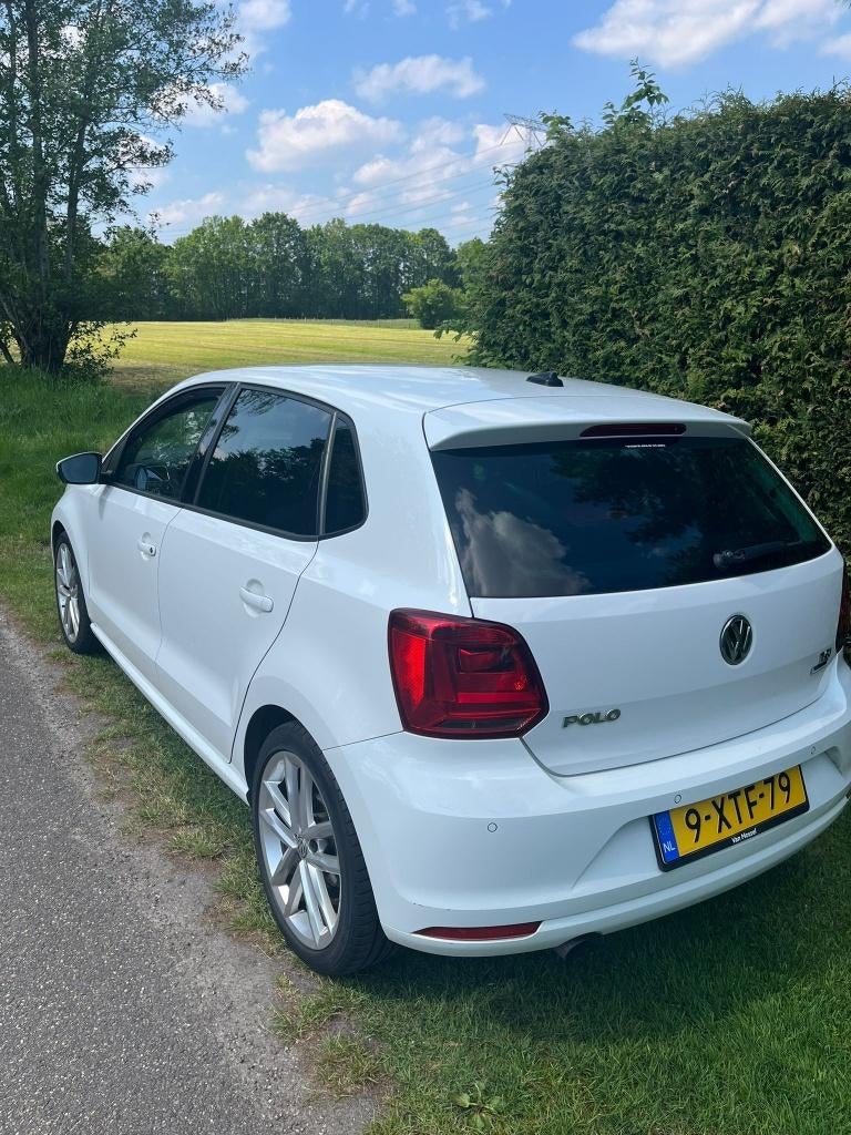 Volkswagen Polo 1.2 TSI 66KW DSG 2014 Wit, Auto's, 40 €/maand, Euro 6, 4 cilinders, 1039 kg