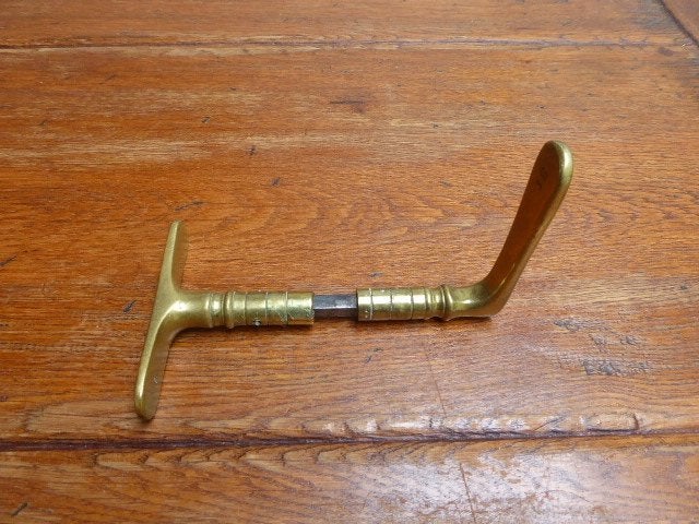 Antieke messing deurklink en –kruk